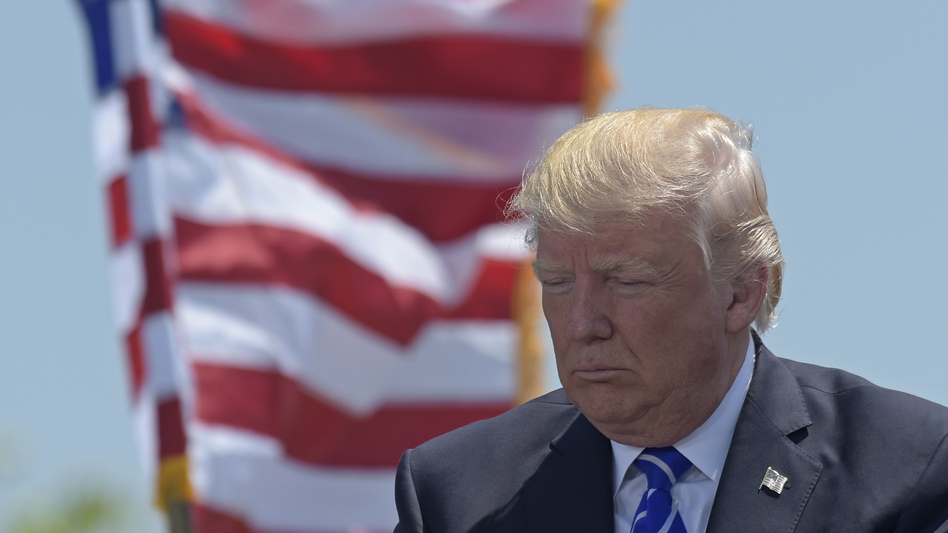 President Trump gives the commencement address at the U.S. Coast Guard Academy in New London, Conn. (Susan Walsh/AP)