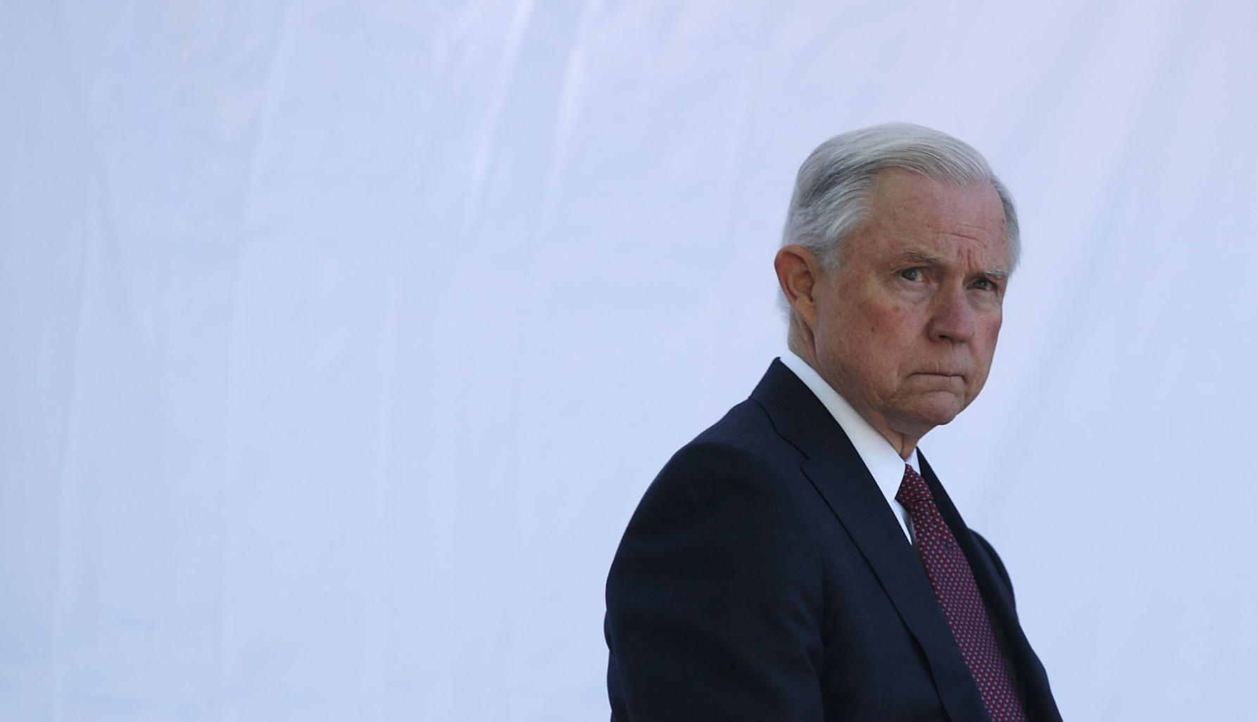 Attorney General Jeff Sessions waits to be introduced during a service at the National Law Enforcement Officers Memorial on May 9 in Washington, D.C. Sessions issued an order on Monday narrowing the scope of his financial threat to "sanctuary cities."