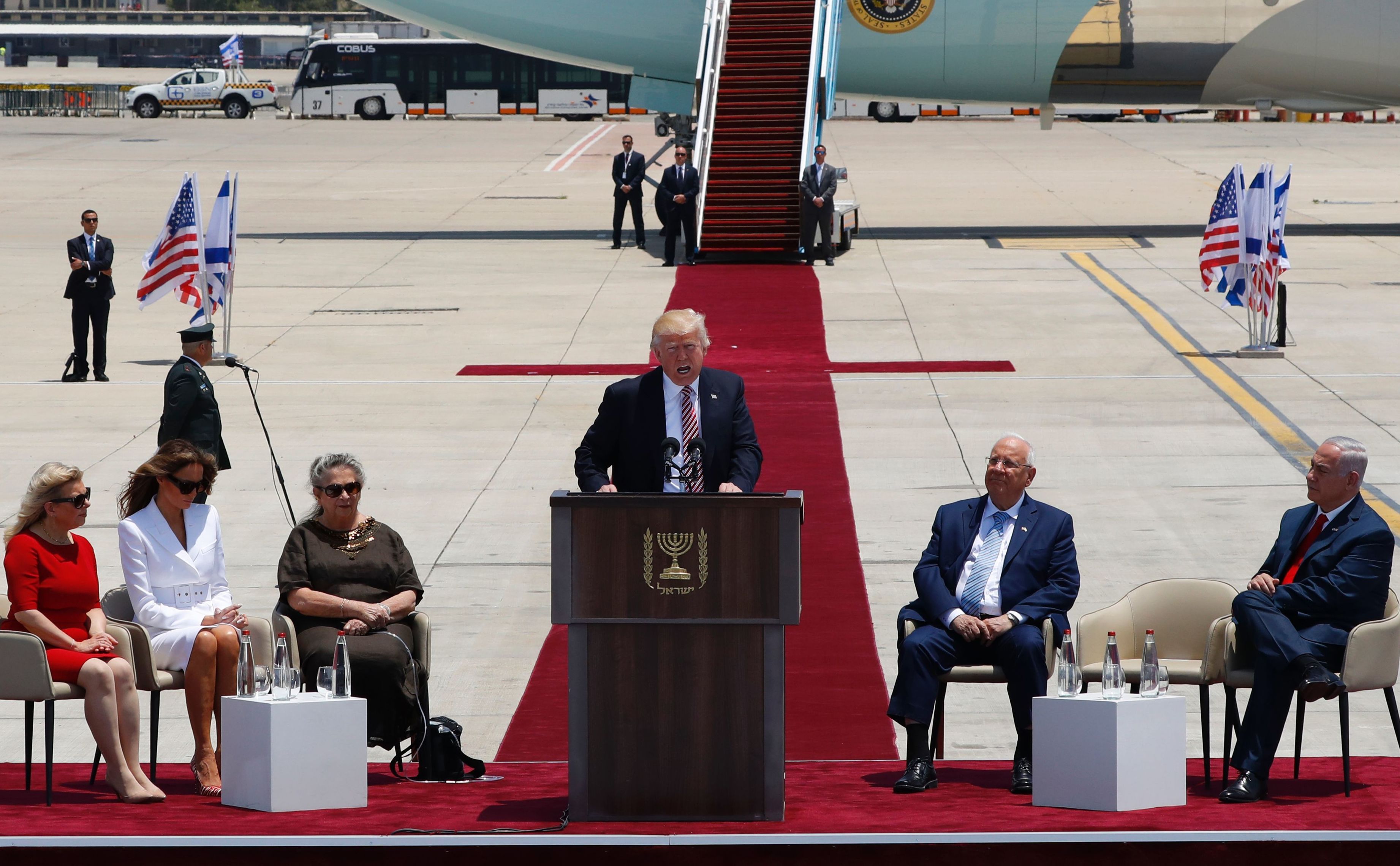 President Trump speaks at a welcome ceremony at Ben Gurion International Airport in Tel Aviv, Israel, on Monday, as Sara Netanyahu (from left), Melania Trump, Nechama Rivlin, Israeli President Reuven Rivlin and Israeli Prime Minister Benjamin Netanyahu listen. (AFP/Getty Images)