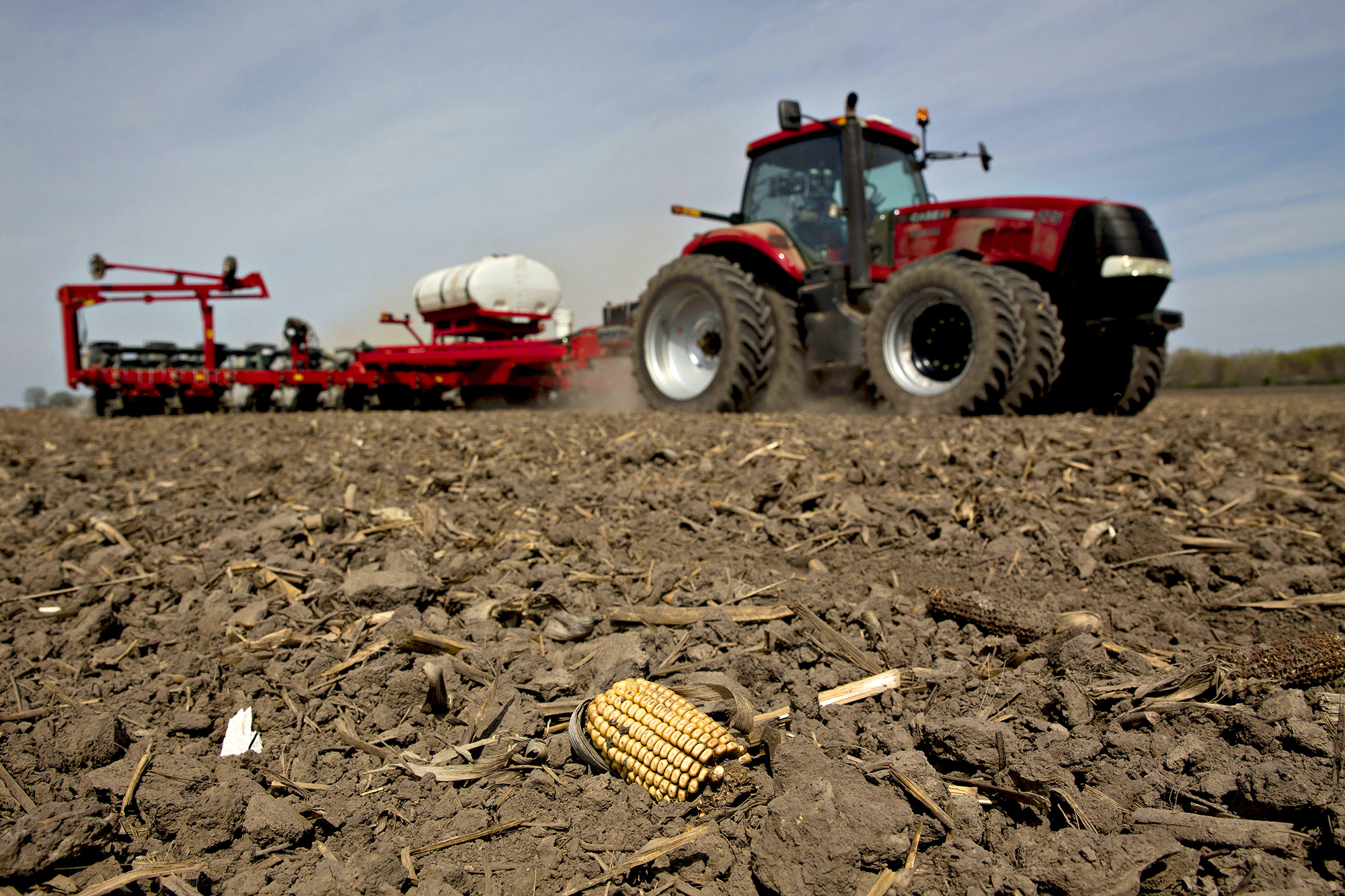 A tractor pulls a planter through a field as corn is planted in Princeton, Ill. (Daniel Acker/Bloomberg/Getty Images)