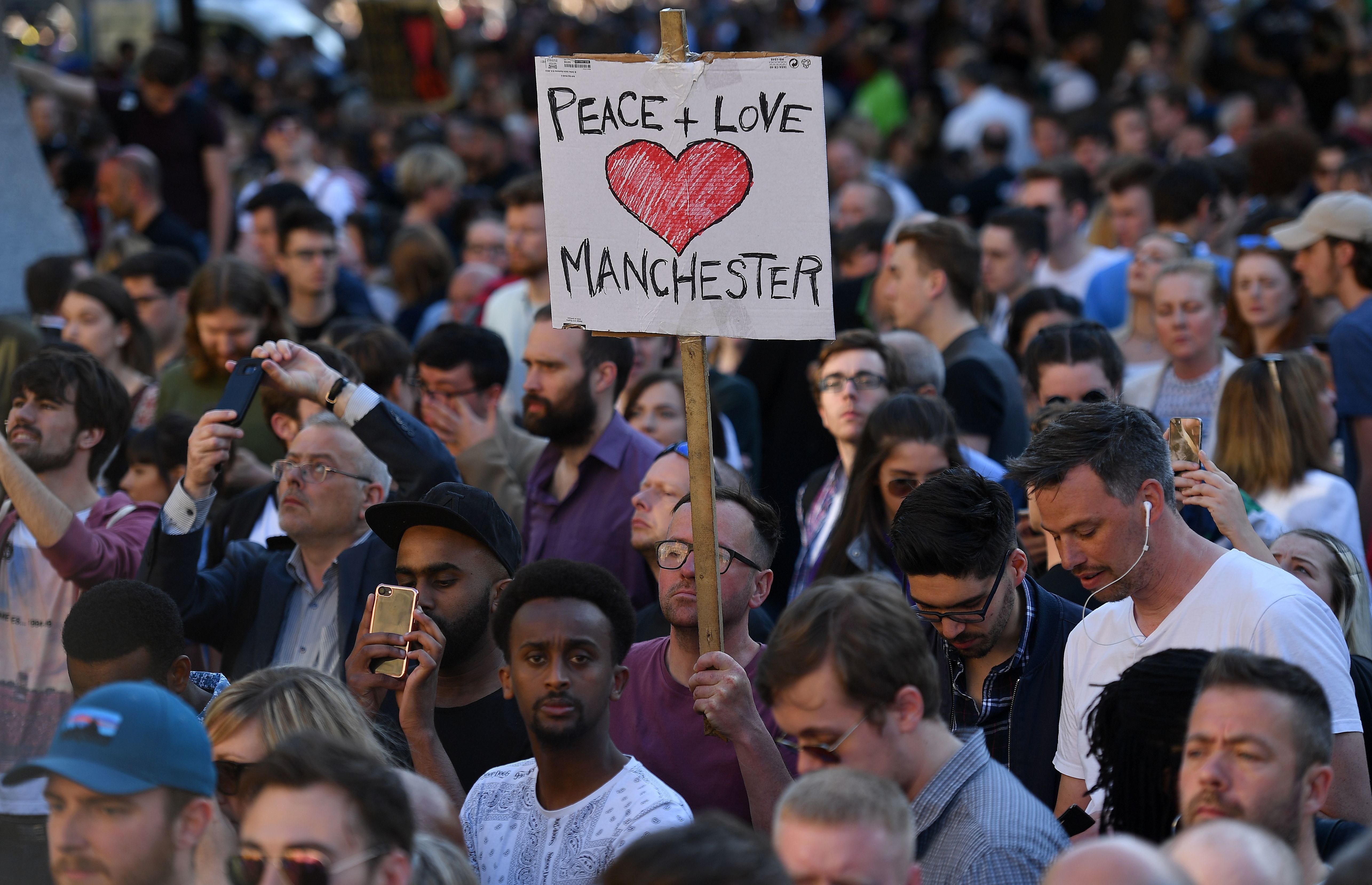 People attend a vigil in Albert Square in Manchester, after the city in northwest England absorbed the worst terror attack on U.K. soil since 2005. (AFP/Getty Images)