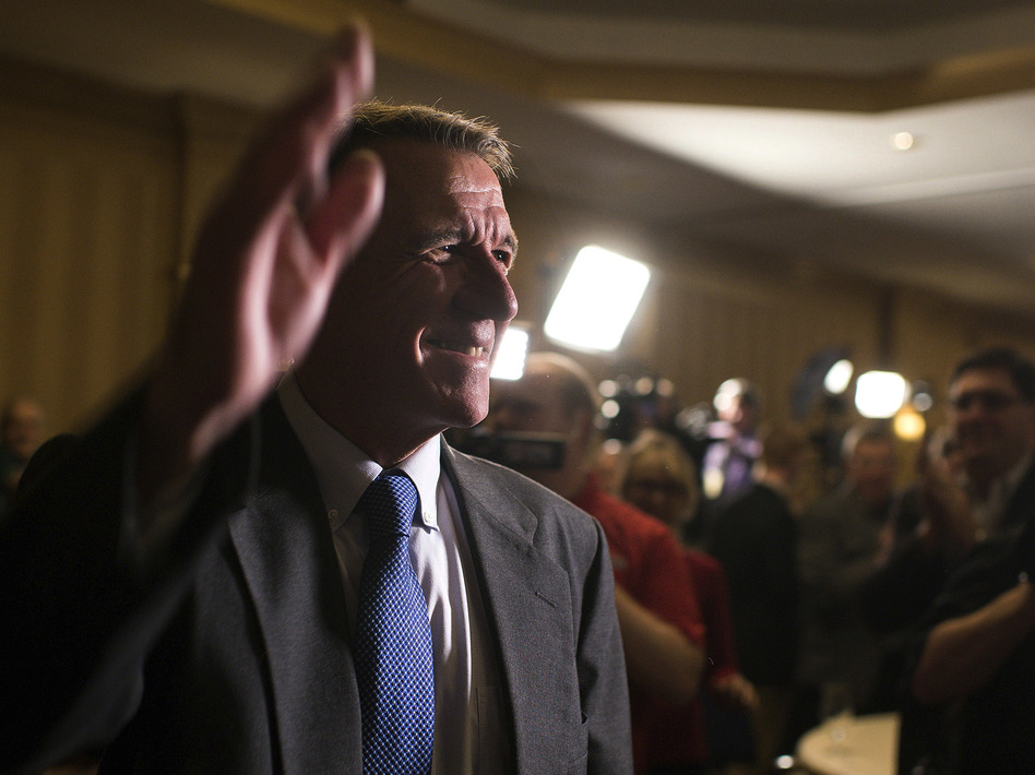Republican Governor Phil Scott announced Wednesday he would veto the Vermont legislature's bill to legalize recreational marijuana. Above, the governor waves to supporters on election night in November. (Andover/AP)