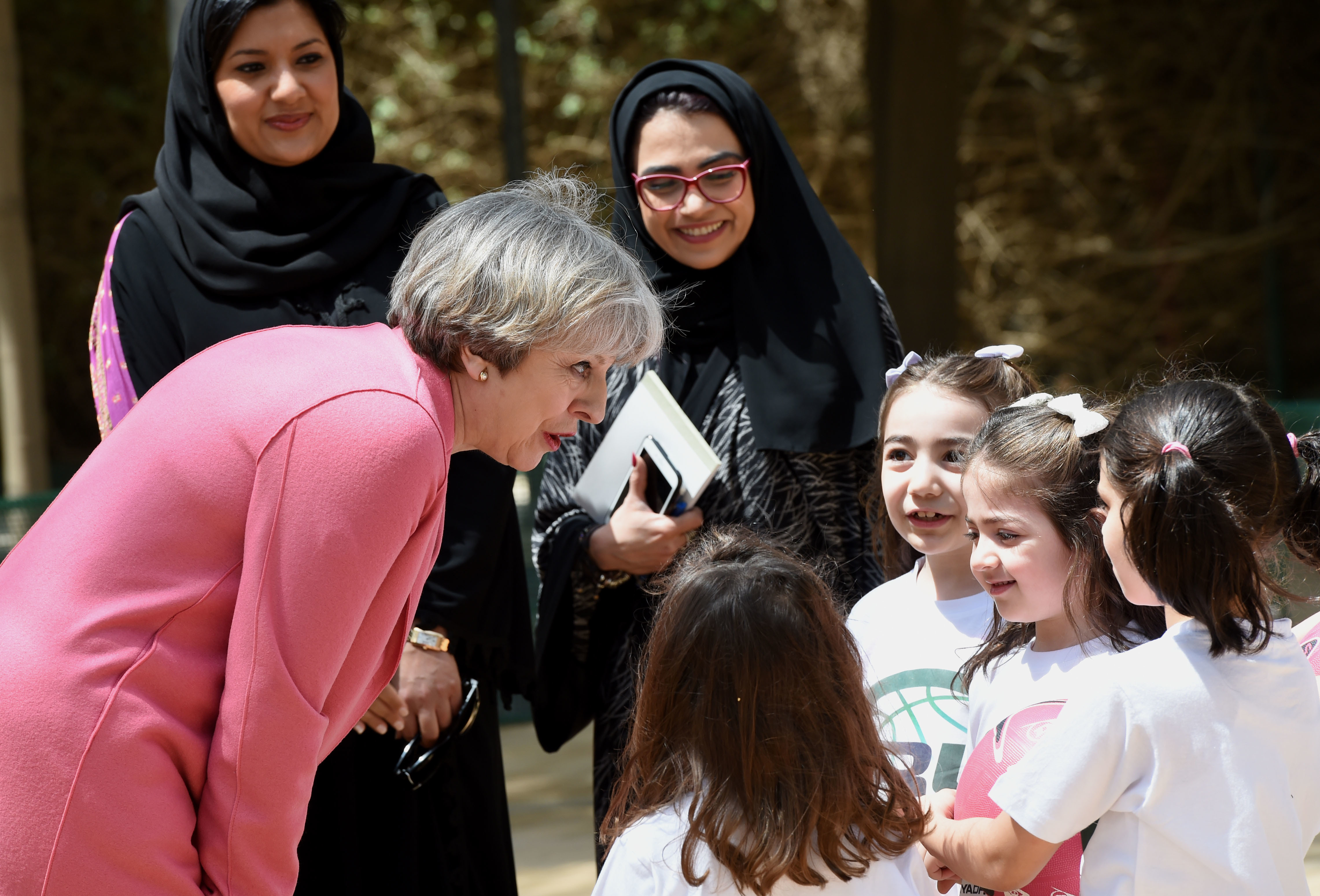 British Prime Minister Theresa May chats with Saudi girls during a basketball class while on a visit to Riyadh last month.