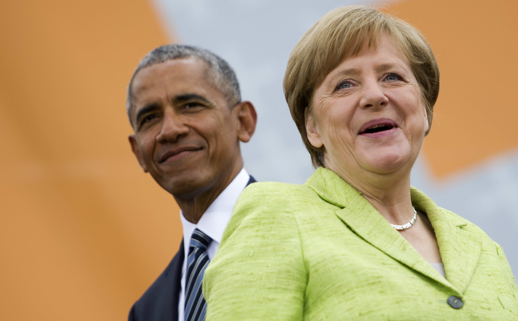 German Chancellor Angela Merkel and former President of the United States Barack Obama arrive for a discussion on democracy in Berlin Thursday.