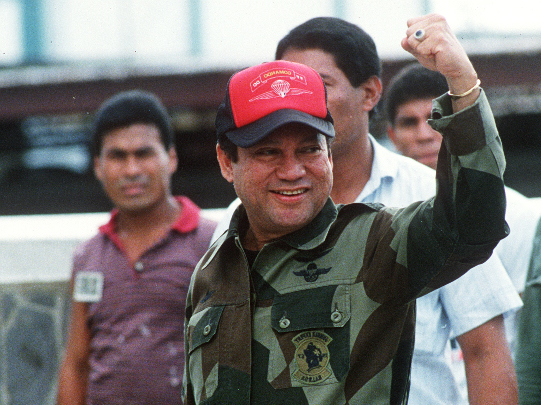 In this 1989 photograph, former Panamanian leader Gen. Manuel Noriega waves while leaving his headquarters in Panama City following a failed coup against him. It was just months before Noriega would surrender power amid a U.S. military operation against his government. (Bob Sullivan/AFP/Getty Images)