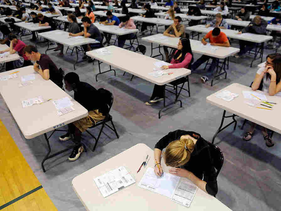 Lindsey Boggess, 17, bottom right, waits with other students to take an AP exam at West Potomac High School on Tuesday May 10, 2011 in Alexandria, VA.