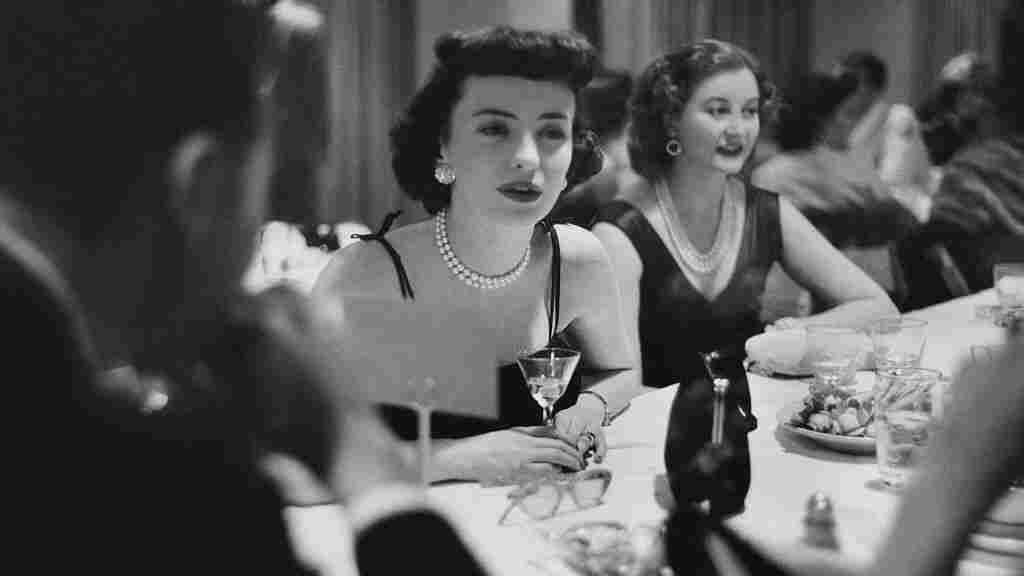 Mrs. Sidney Wood (left) seated at table with Mrs. Stass Reed at the Town Tennis Club in New York City. (Photo by Clifford Coffin/Conde Nast via Getty Images)