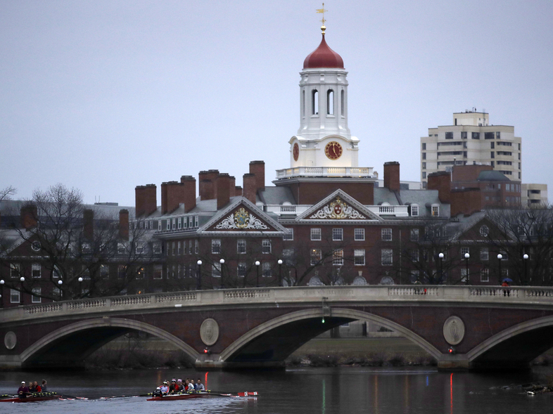 At least 10 admitted Harvard students had their admissions offers rescinded after a group exchange of racist and sexually offensive Facebook messages. (Charles Krupa/AP)