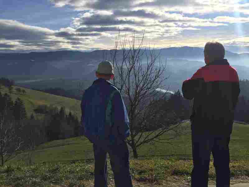 Two men stare into the distance in the hills of Gortina, Slovenia.