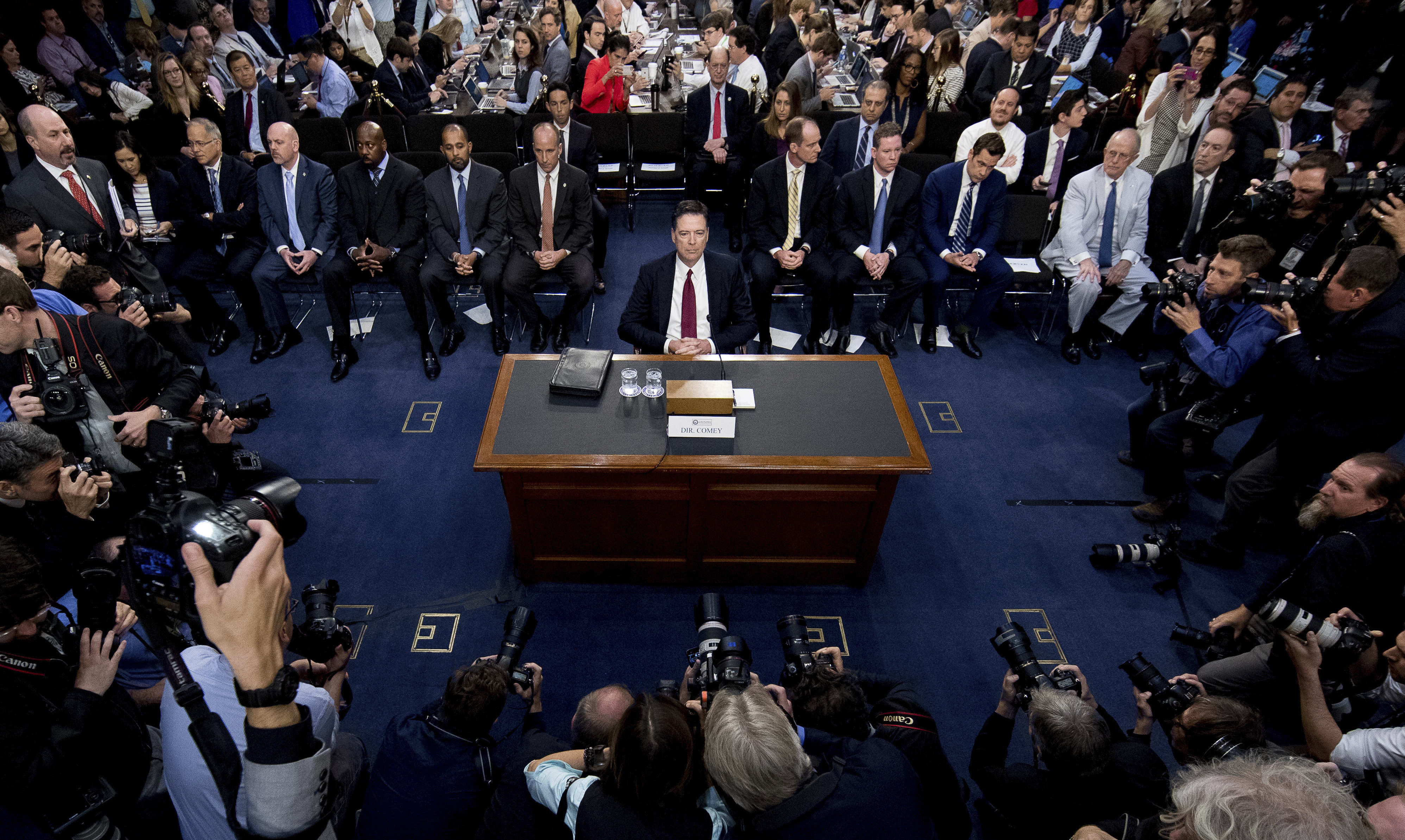 Former FBI Director James Comey testifying before Congress