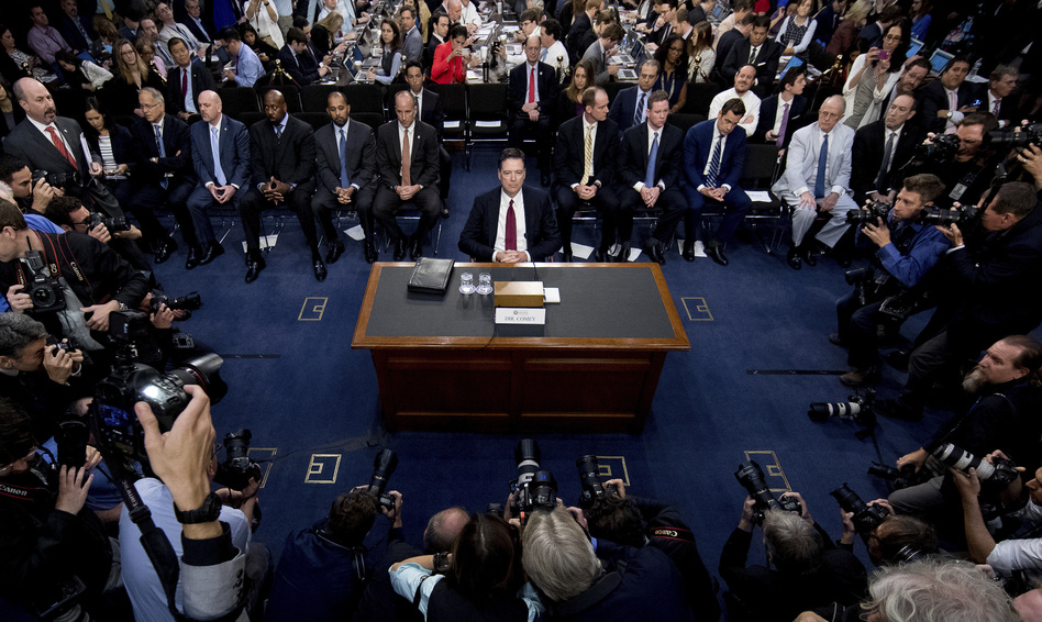Former FBI Director James Comey takes his seat to testify at a Senate Intelligence Committee hearing on Capitol Hill on Thursday. (Andrew Harnik/AP)