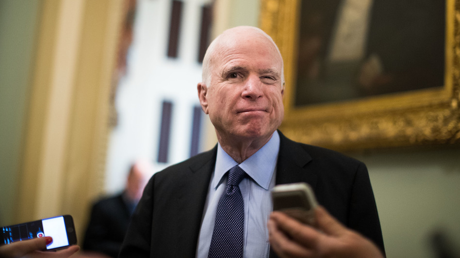 Sen. John McCain, R-Ariz., speaks with reporters outside of the Senate chamber, on Capitol Hill, in March. (Drew Angerer/Getty Images)