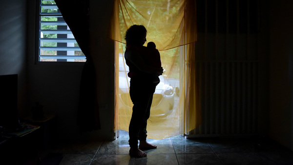 Michelle Flandez at home in Bayamon, Puerto Rico, in 2016 with her infant son Inti Perez. The baby was born with microcephaly linked to the mosquito-borne Zika virus.