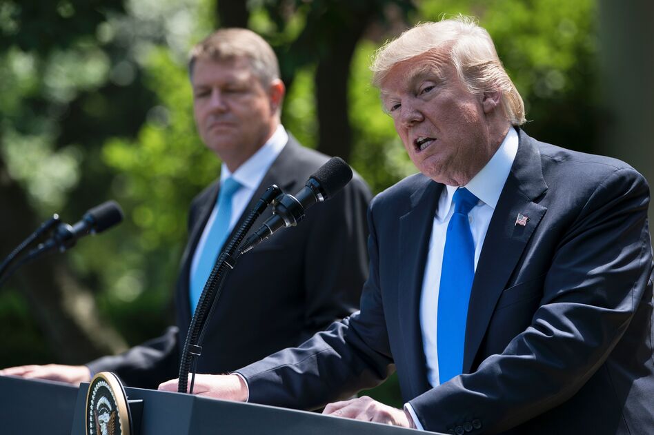 President Trump and Romania's President Klaus Iohannis at a press conference in the Rose Garden of the White House on Friday. (Brendan Smialowski/AFP/Getty Images)