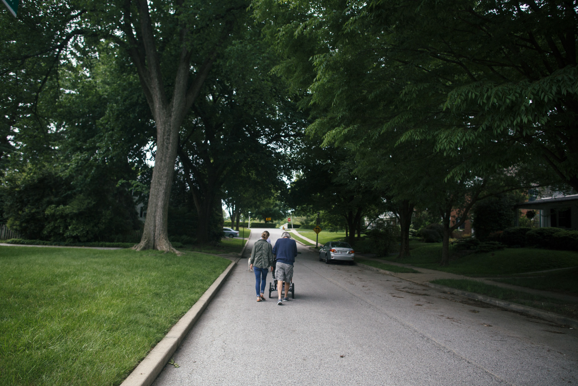 Greg and Colleen go for a walk with Adeline near Colleen's home in Baltimore. Grandfather and granddaughter interact naturally, with "a lot of snuggling," Colleen says.