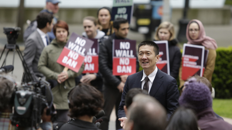 Hawaii Attorney General Doug Chin speaks to media outside the 9th Circuit U.S. Court of Appeals in Seattle on May 15. The court has largely upheld a preliminary injunction blocking President Trump's travel ban from going into effect. (Jason Redmond/AFP/Getty Images)