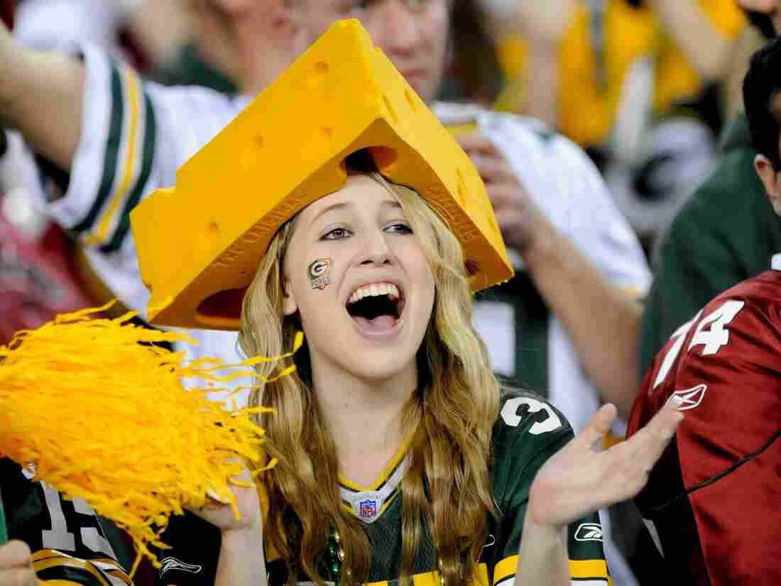 GLENDALE, AZ - JANUARY 10: A fan of the Green Bay Packers with a cheese head cheers against the Arizona Cardinals in the NFC wild-card playoff game at University of Phoenix Stadium on January 10, 2010 in Glendale, Arizona. The Cardinals won the game 51-45 in overtime. (Photo by Rob Tringali/Sportschrome/Getty Images)