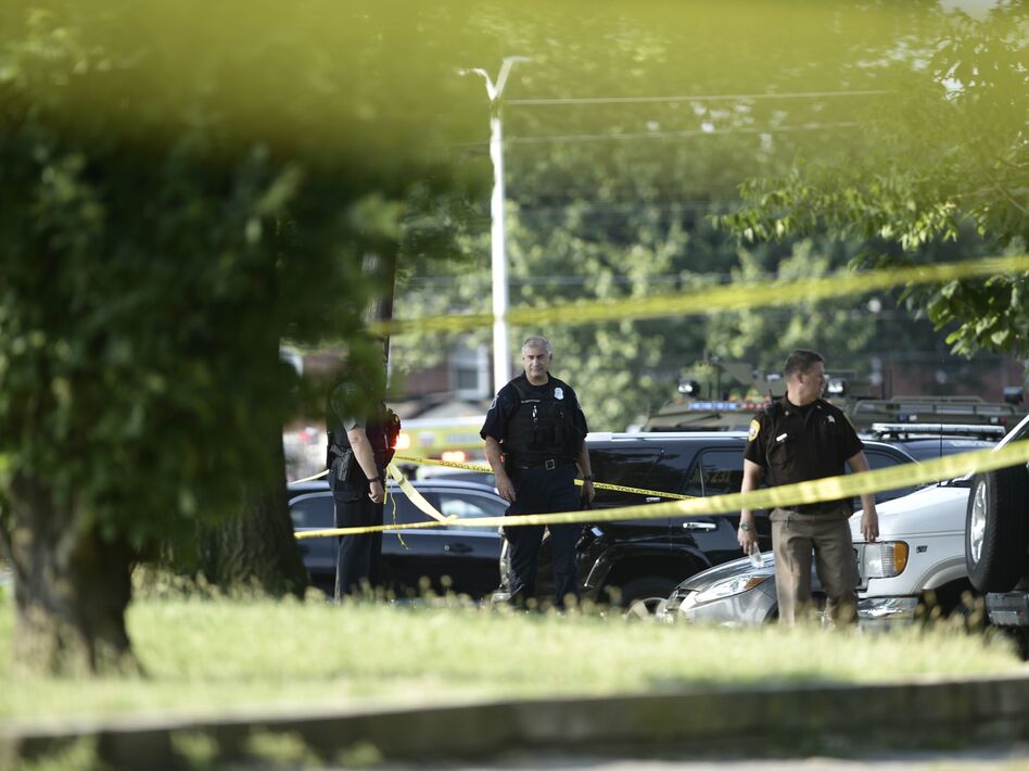 Police tape cordons off the scene of an early morning shooting in Alexandria, Va., June 14. (Brendan Smialowski /AFP/Getty Images)