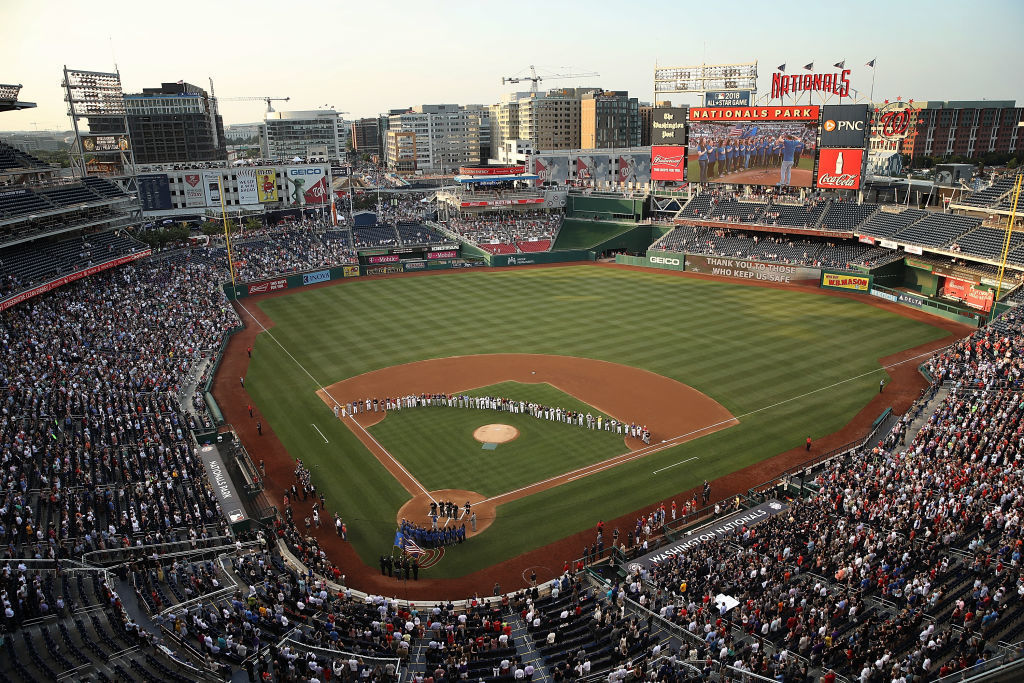 Members of the Republican and Democratic congressional baseball teams gather for a moment of silence before the Congressional Baseball Game on Thursday. (Getty Images)