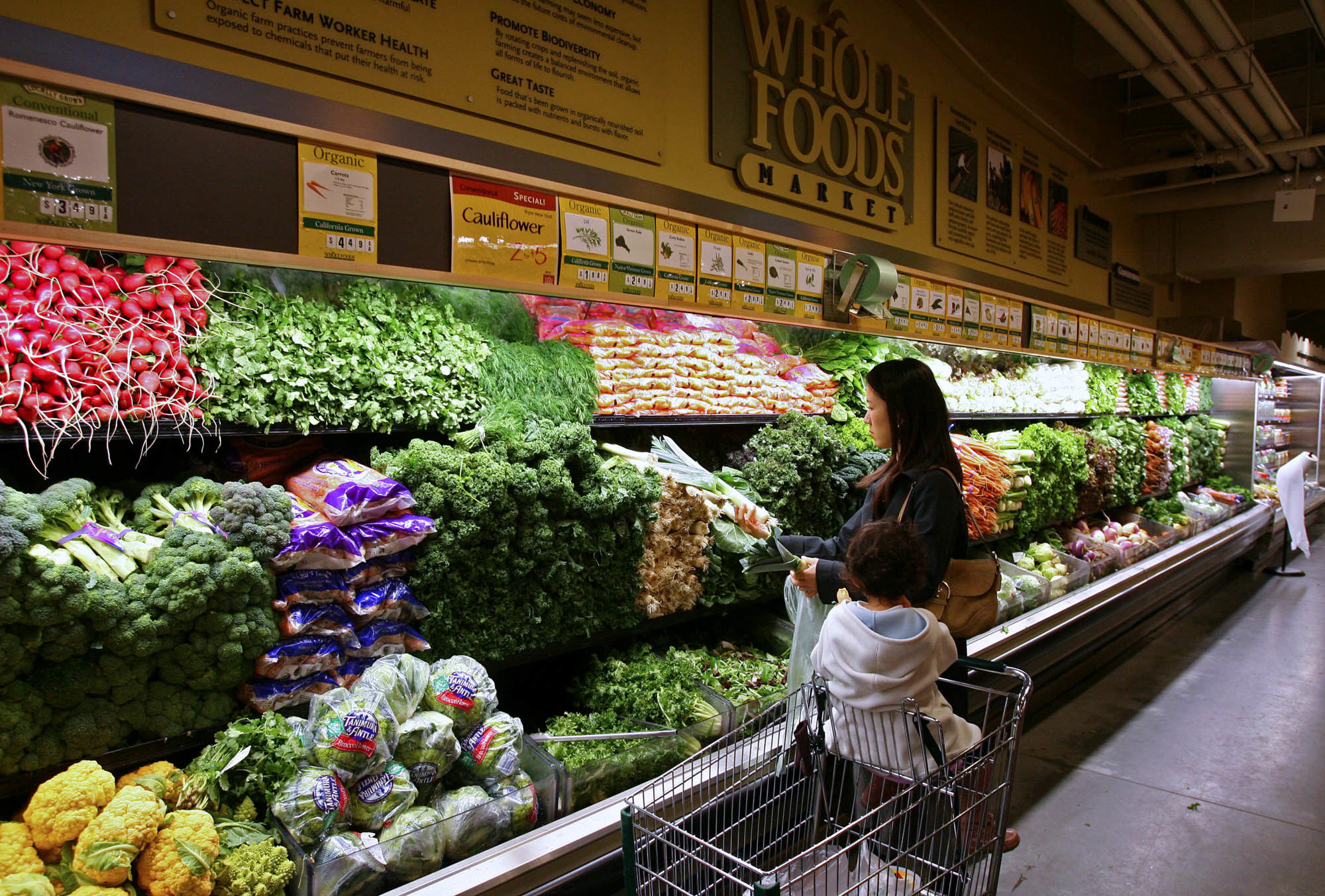 Analysts say that the experience of shopping at Whole Foods might change in the near future now that the retailer is being bought by Amazon. (Bloomberg/Getty Images)