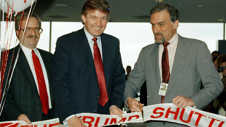 Back when commercial lenders were eager to do business with him, Donald Trump briefly operated an airline. In this 1989 picture, Trump attends a ribbon-cutting for the venture at Boston's Logan International Airport. (Elise Amendola/AP)