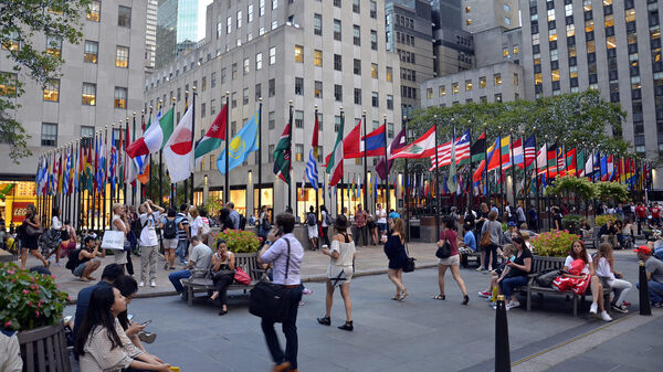 Pedestrians walk through Rockefeller Center in New York City. According to the U.S. Census Bureau, the Asian population recently grew by 3 percent to 21.4 million and people who identified as being of two or more races grew by 3 percent to 8.5 million.