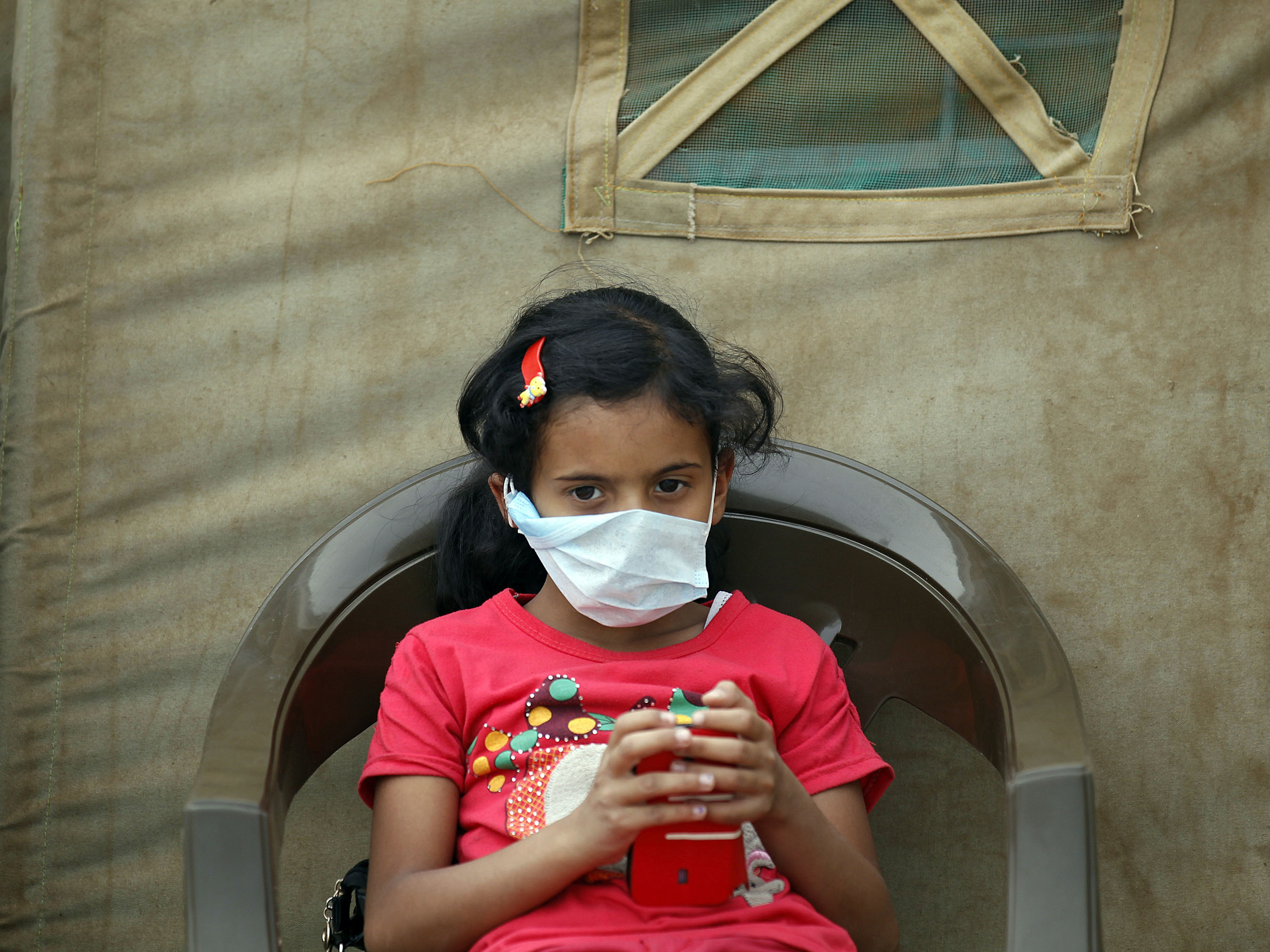 A Yemeni child suspected of having cholera sits outside a makeshift hospital in the capital, Sanaa, earlier this month. World health authorities say that of the more than 1,300 people who have died of the disease, a quarter have been children.