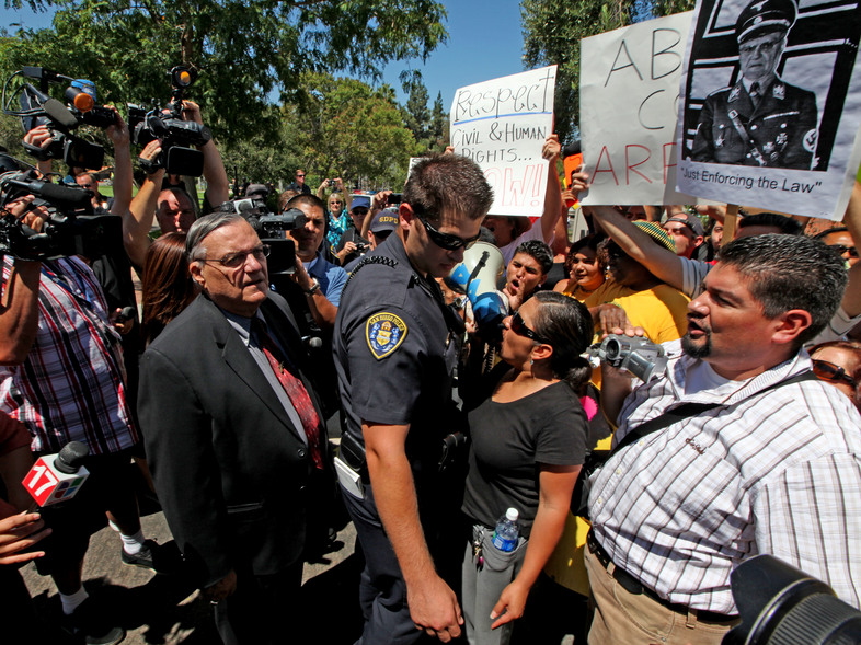 Arpaio confronts protesters during a 2010 rally in Rancho Bernardo, California. (Sandy Huffaker/Getty Images)