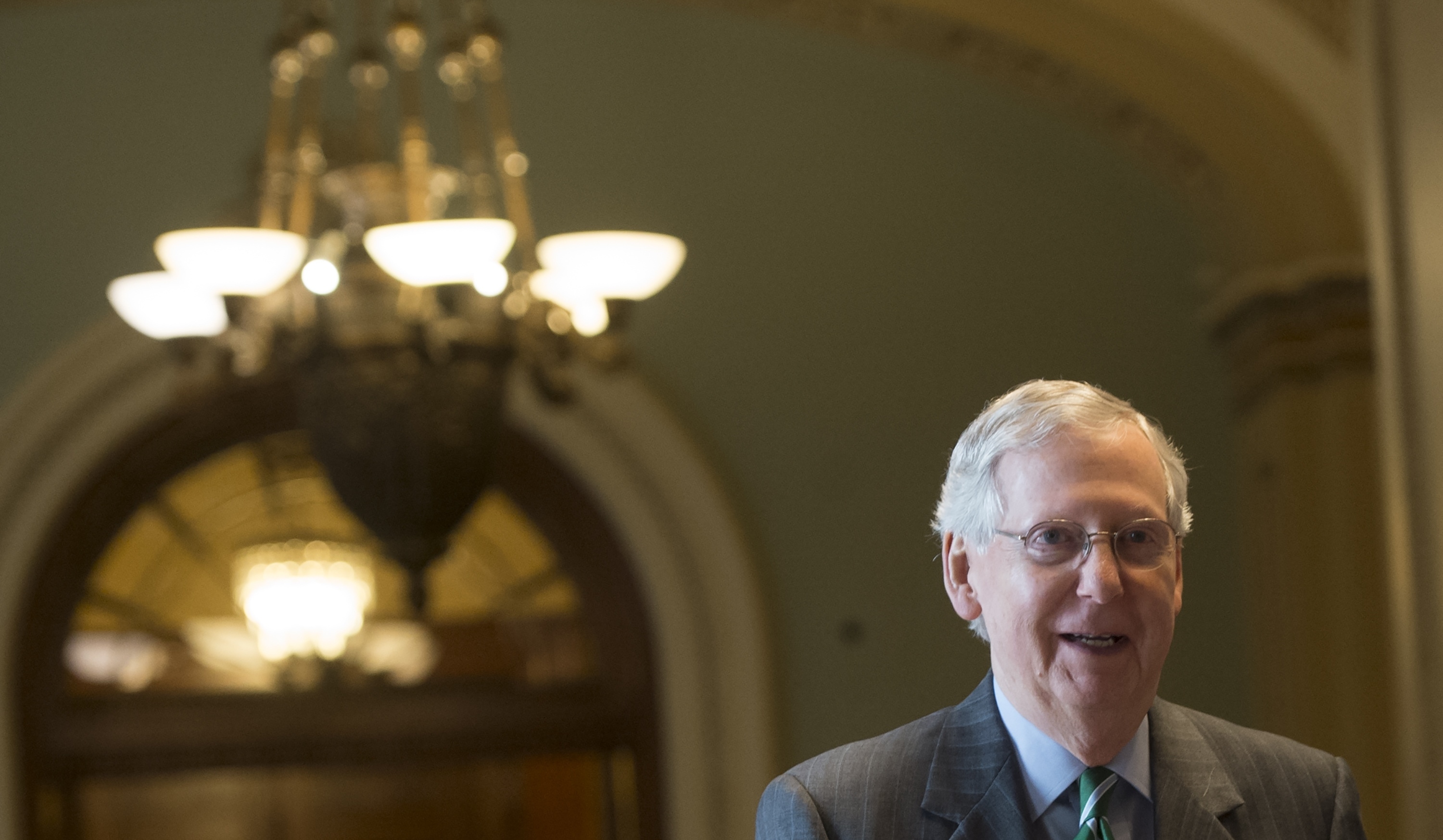 Senate Majority Leader Mitch McConnell, R-Ky., walks through the U.S. Capitol on Thursday following the release of a draft of the Senate Republicans' health care bill. An updated version was released on Monday. (AFP/Getty Images)