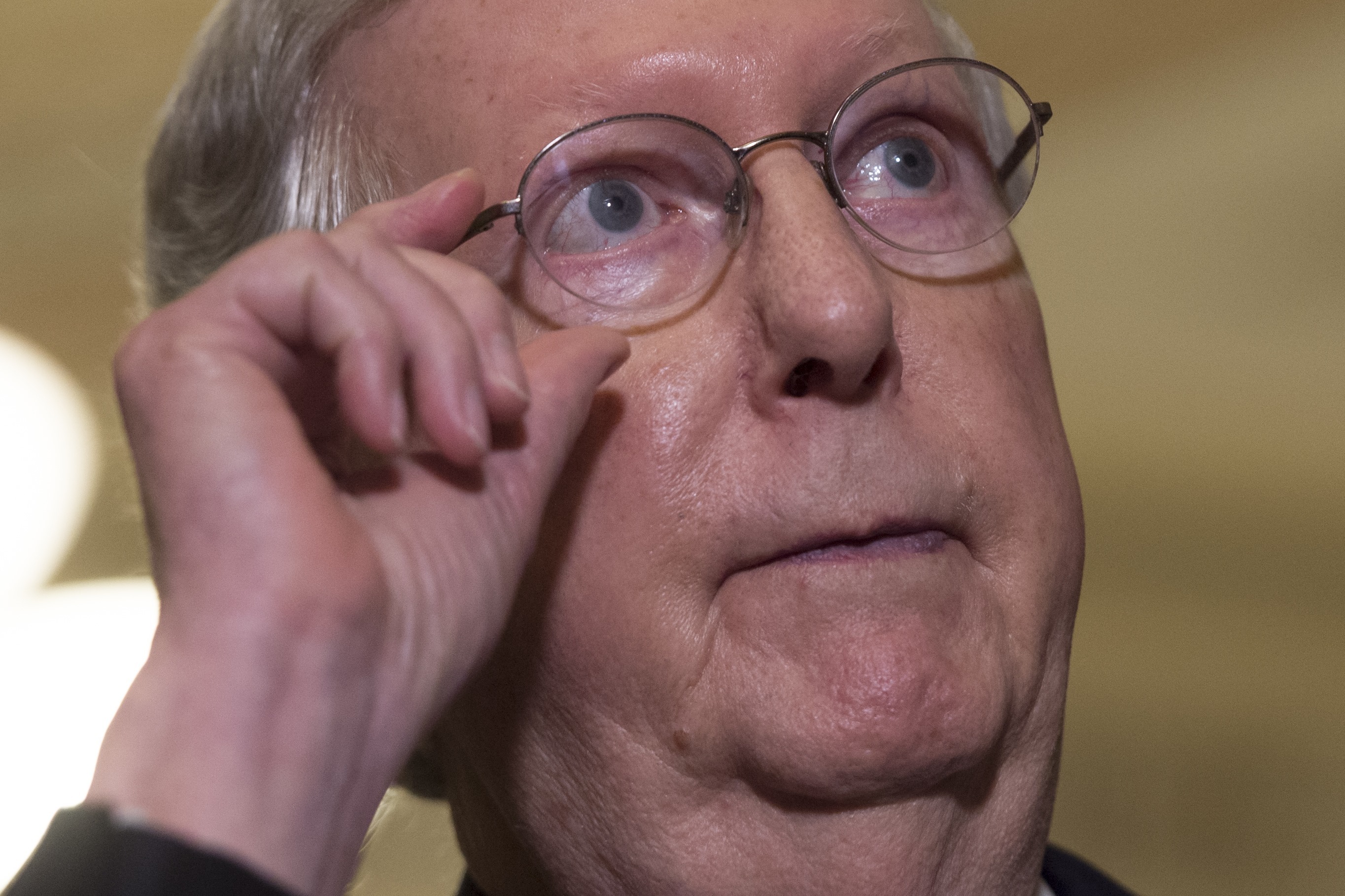 Senate Majority Leader Mitch McConnell, R-Ky., talks to reporters at the Capitol on Tuesday about his decision to delay a vote on the GOP health care bill. (AFP/Getty Images)