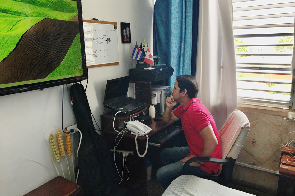 Harold Cardenas Lema runs the blog <em>La Joven Cuba</em> out of the two-room apartment he shares with his mom and girlfriend. (Carrie Kahn/NPR)