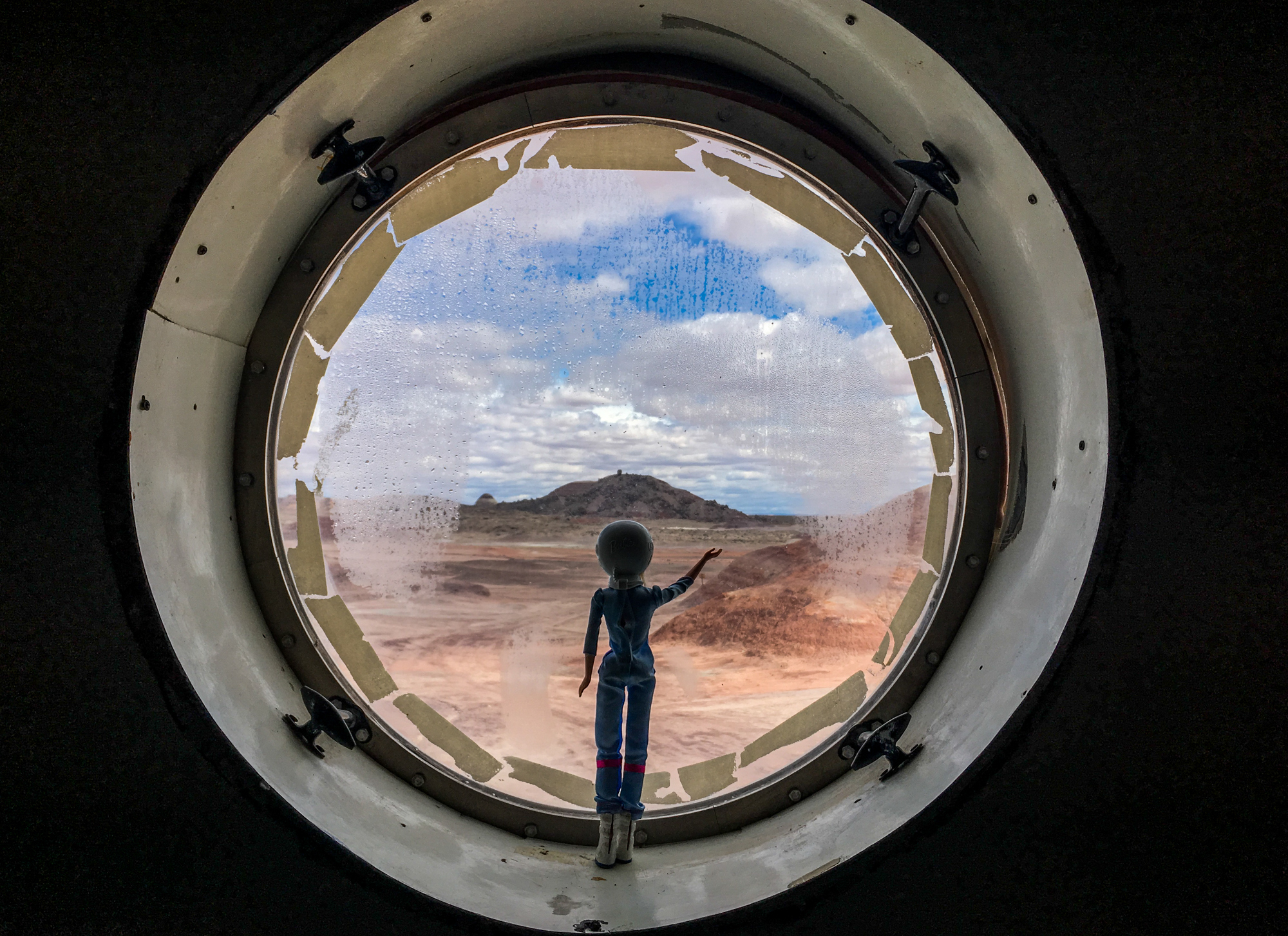To Prepare For Mars Settlement, Simulated Missions Explore Utah's Desert 8 An astronaut Barbie waves from the habitat's porthole. LaBarre "rescued" the doll in a test of the crew's prototype emergency rover.