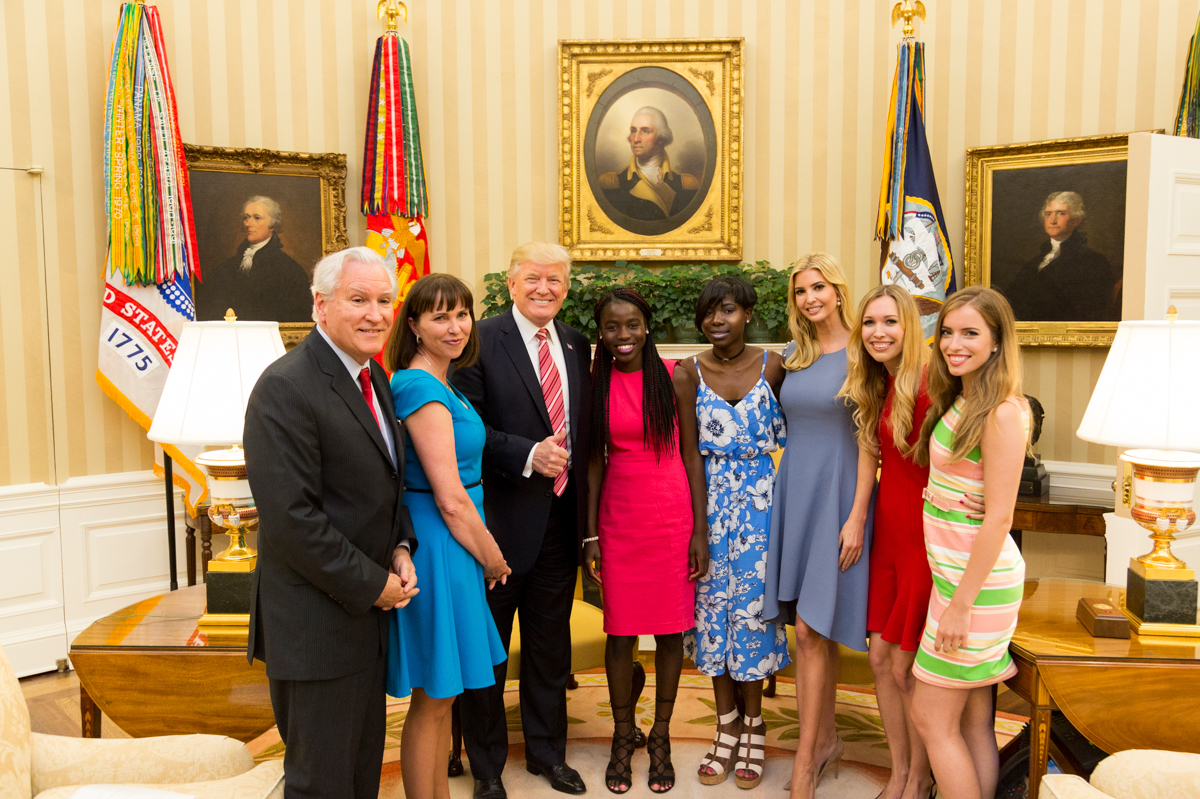 President Donald Trump and his daughter Ivanka flank Chibok schoolgirls (left to right) Joy Bishara and Lydia Pogu. At far left is Doug Wead, president of the school the girls attend, and his wife, Myriam. Two of his daughters are at the right. This White House &quot;Photo of the Day&quot; was taken on June 27. (Shealah Craighead/White House)