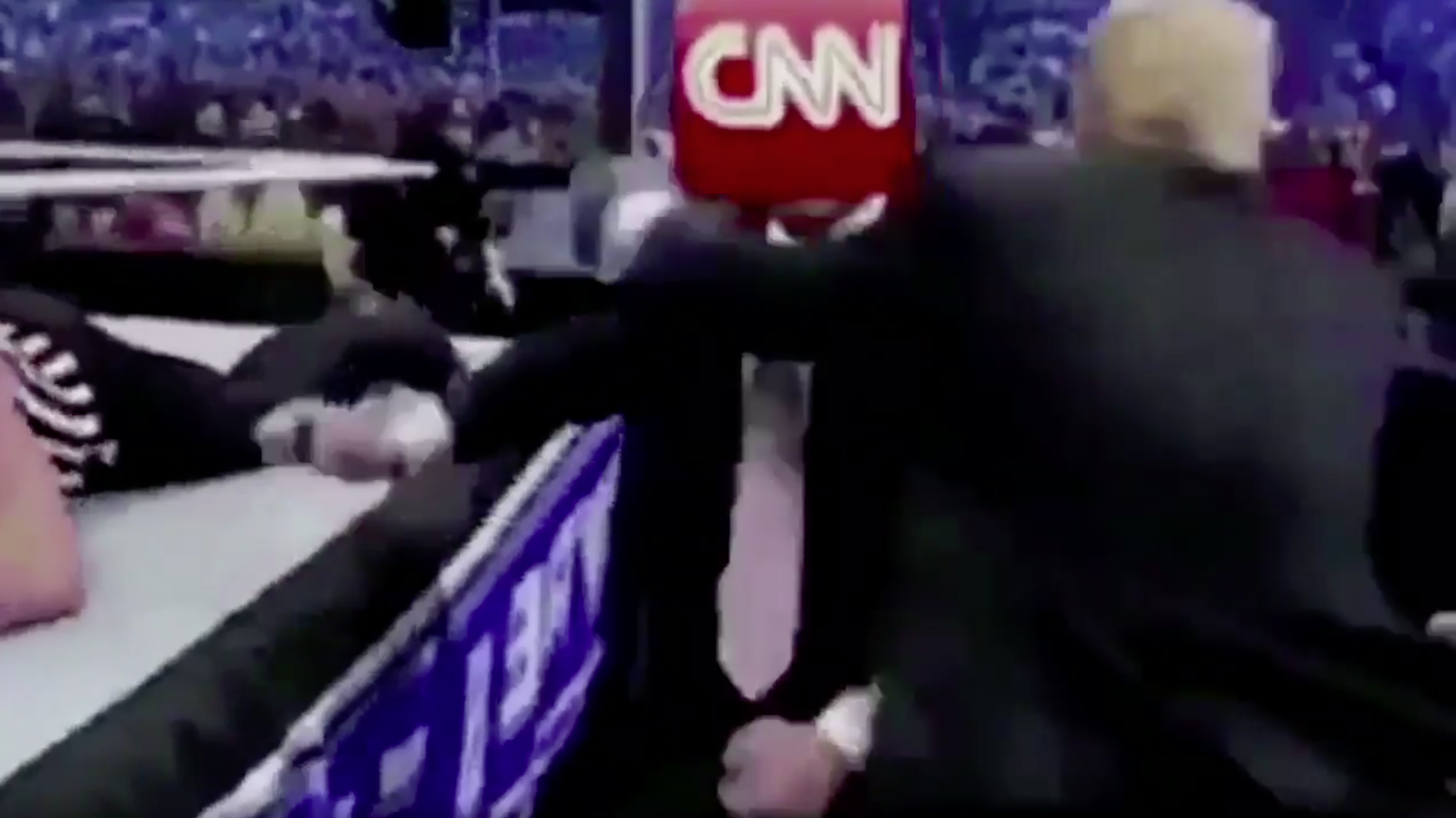 A Reddit post of a man in a business suit with the CNN logo for a head getting demolished by Trump in a wrestling match, was shared by the president himself on Twitter Sunday morning. (Screenshot by NPR)