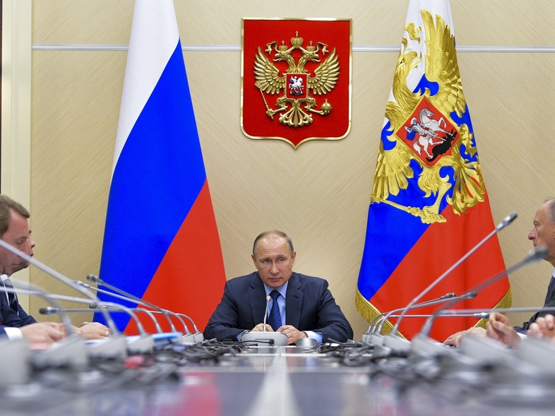 Russian President Vladimir Putin chairs a meeting of the Commission for Military Technology Cooperation outside Moscow on Thursday, ahead of Friday's G-20 meeting in Hamburg. (Alexei Druzhinin/AP)