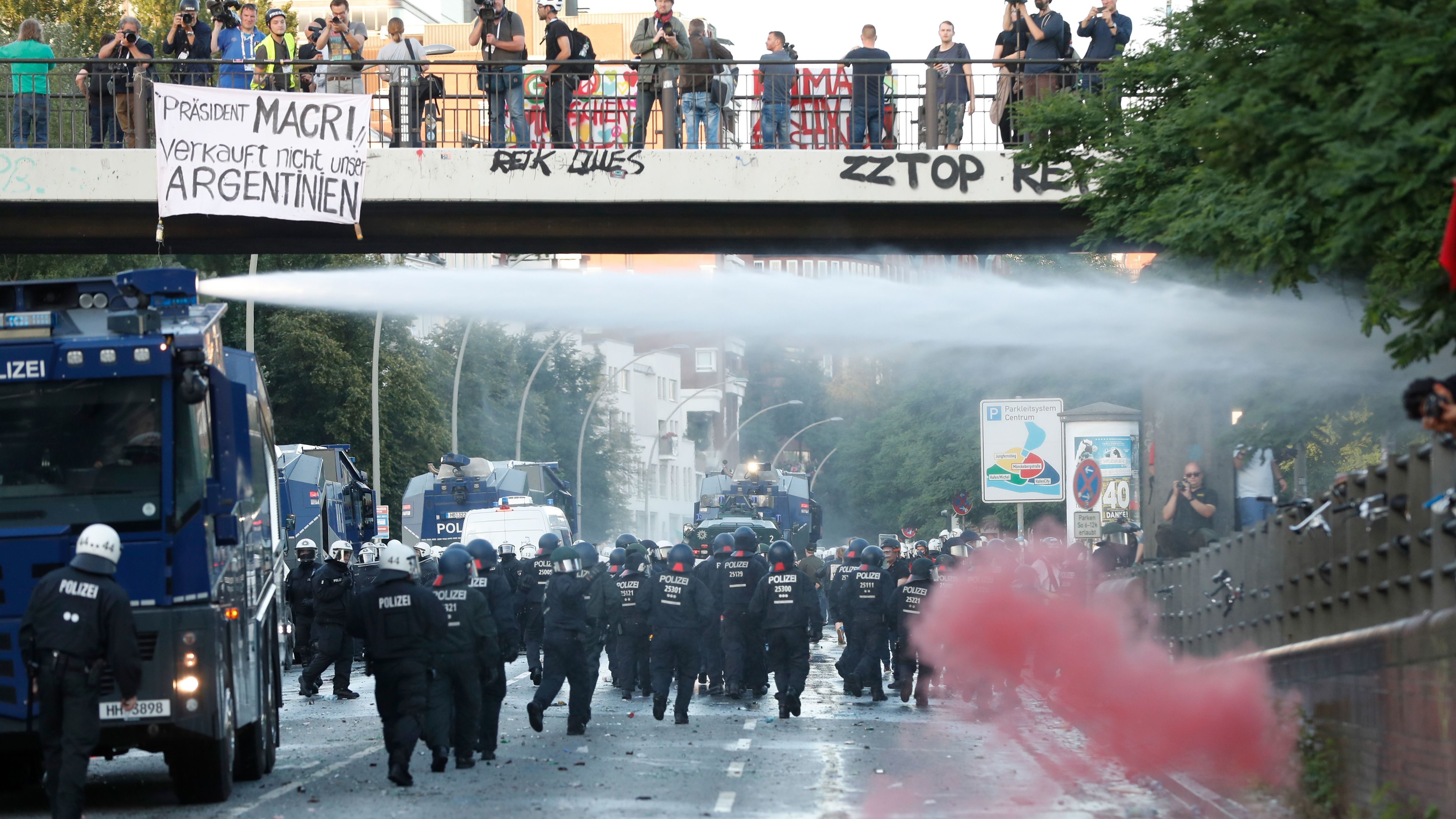 Riot police use a water cannon and pepper spray to disperse protesters on Thursday in Hamburg, Germany, ahead of the Group of 20 summit.