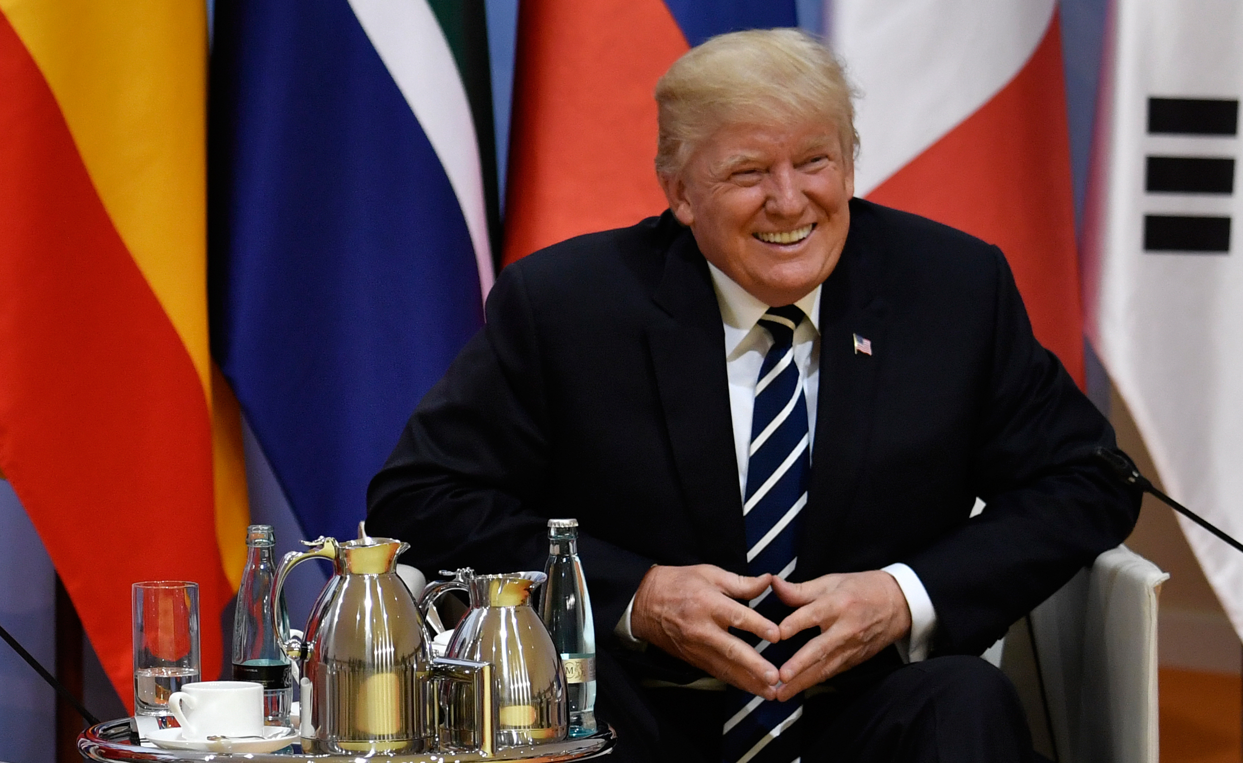 President Trump is at the Group of 20 summit in Hamburg, Germany, this week. On Friday, he tweeted that "everyone here is talking about" John Podesta and the Democratic National Committee. Podesta responded on Twitter. (AFP/Getty Images)