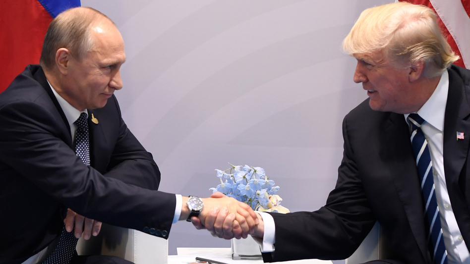 President Trump and Russian President Vladimir Putin shake hands during a meeting on the sidelines of the Group of 20 summit in Hamburg, Germany, on Friday. (Saul Loeb/AFP/Getty Images)
