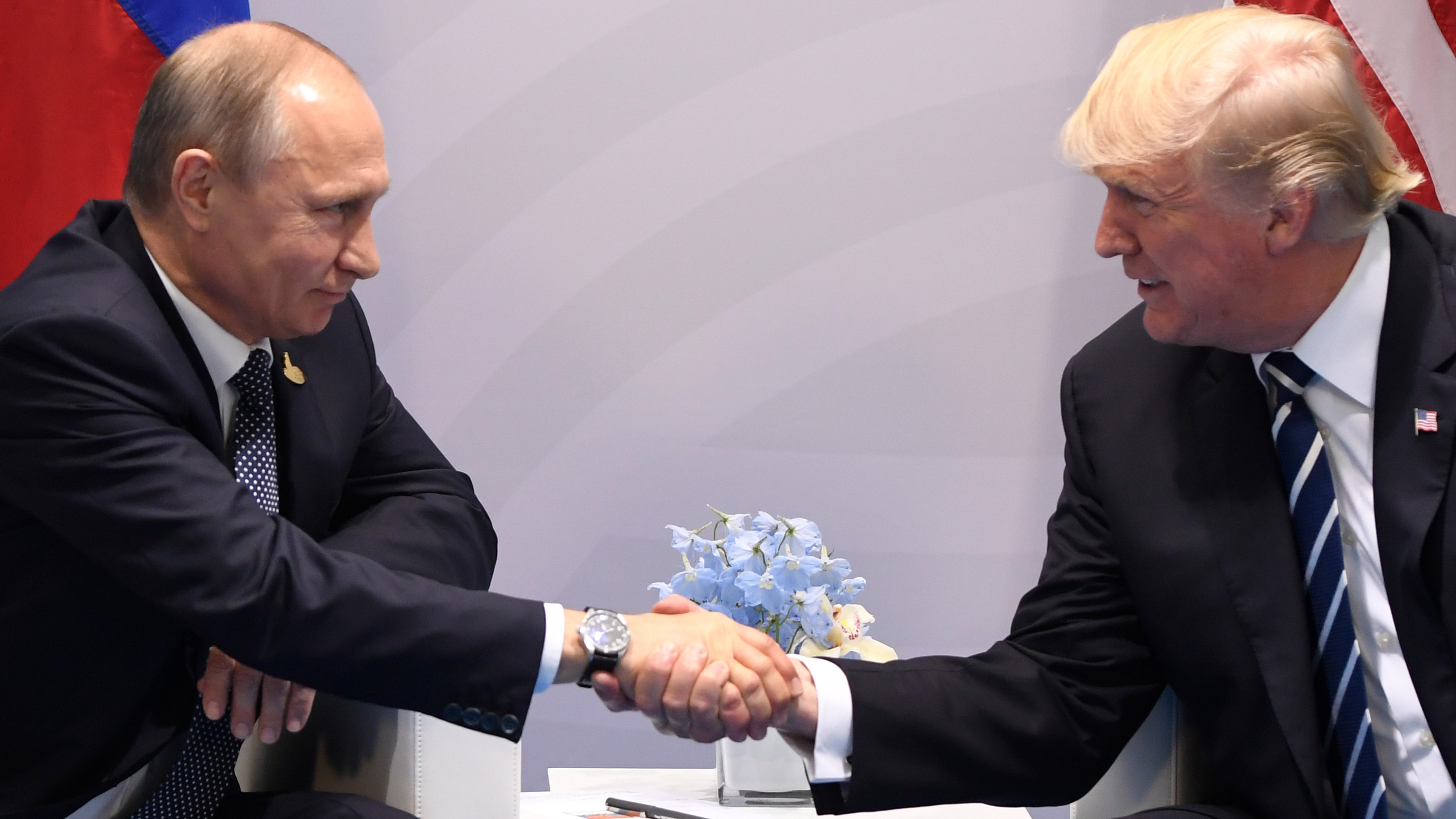 President Trump and Russian President Vladimir Putin shake hands during a meeting on the sidelines of the Group of 20 summit in Hamburg, Germany, on Friday. (AFP/Getty Images)