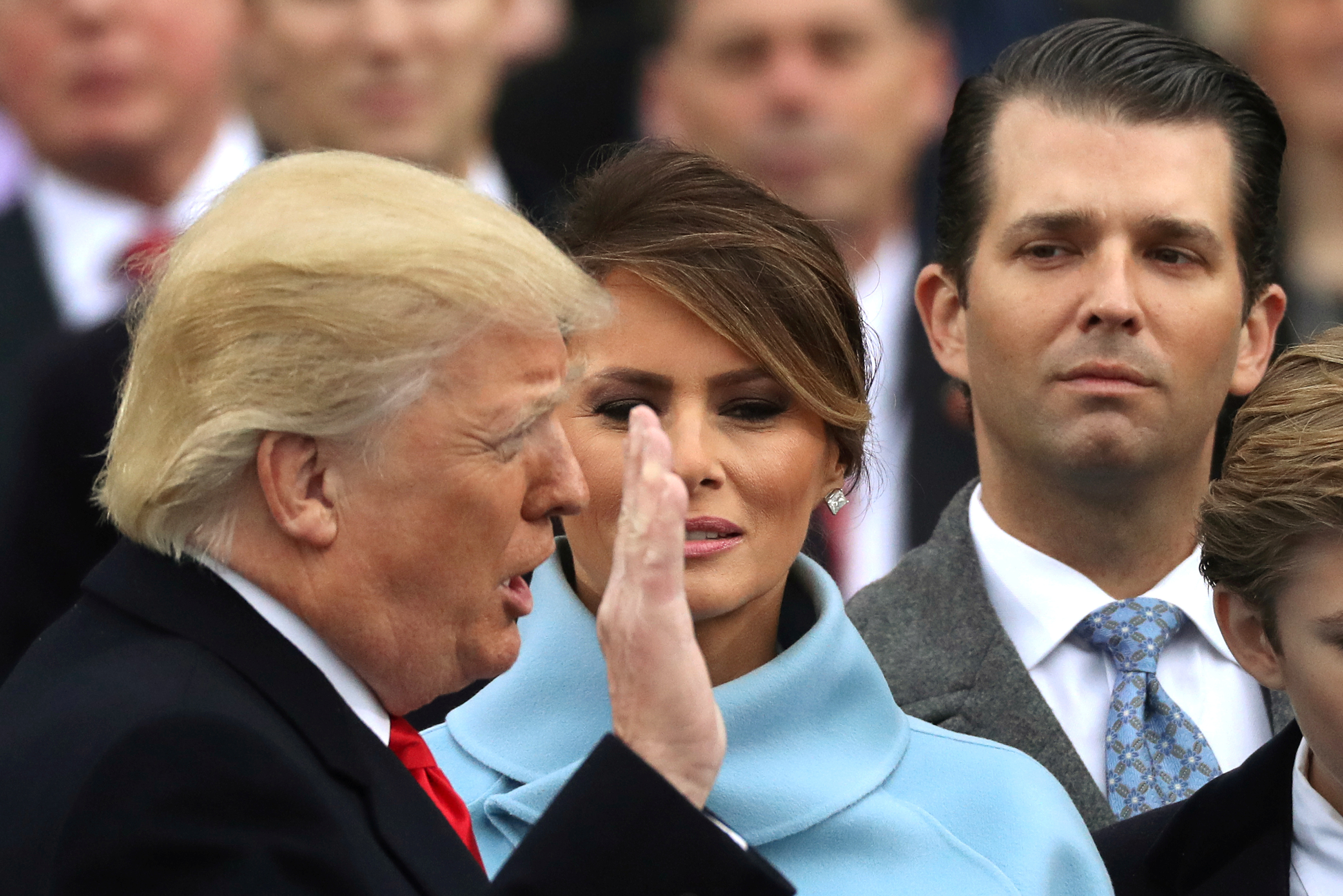 Donald Trump Jr., far right during his father's inauguration, has released an email exchange about setting up a meeting in 2016 with a Russian lawyer who he is told has damaging information about Hillary Clinton. (Reuters)