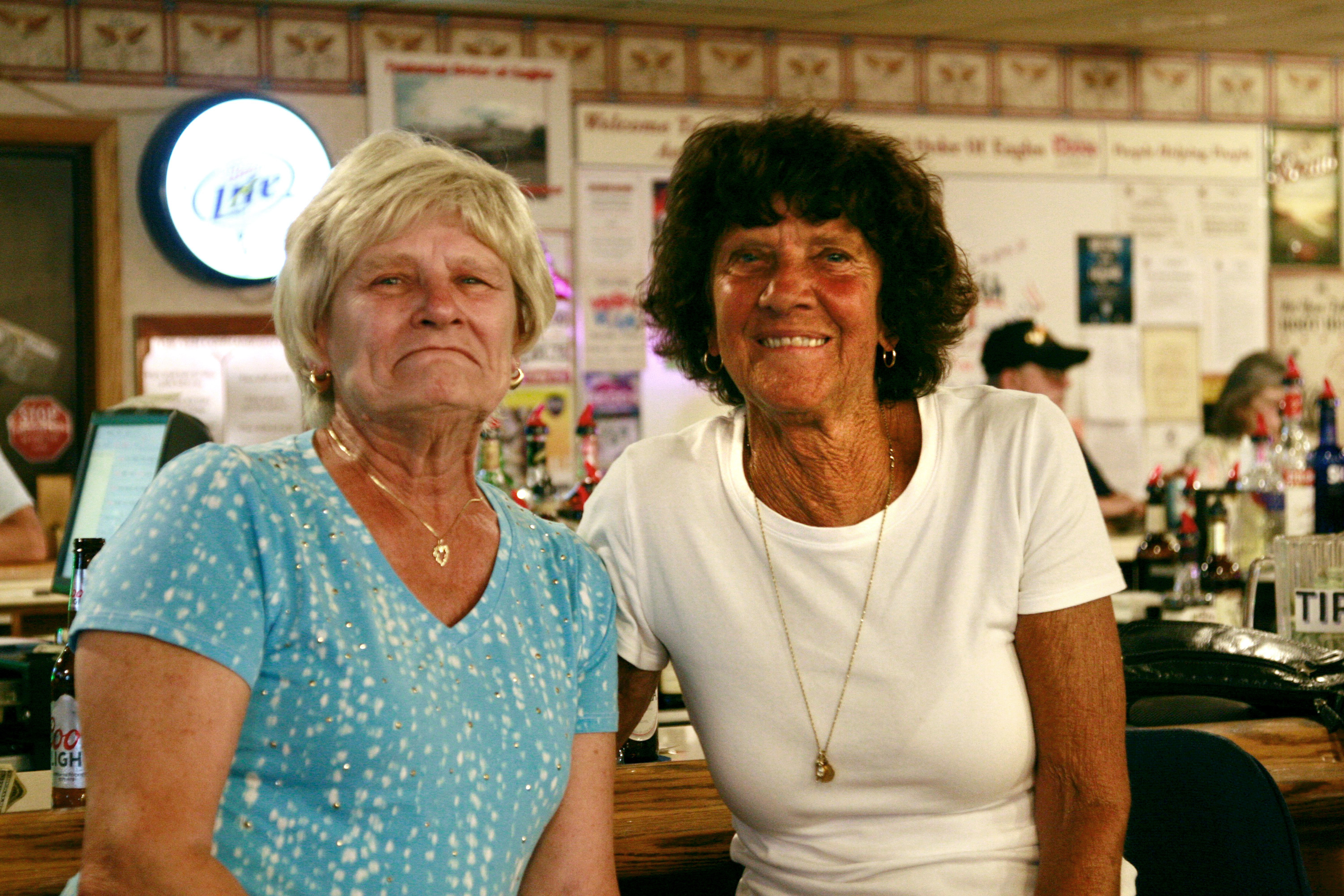 Elaine Latuch (left) and Mary Denning enjoy burger night at the Fraternal Order of Eagles in Somerset County, Pa. The county, Latuch says, offers &quot;nothing&quot; for younger people, so they leave. (NPR)