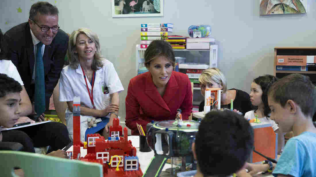 First Lady's Day in Paris Includes Children's Hospital, Church And An Awkward Moment