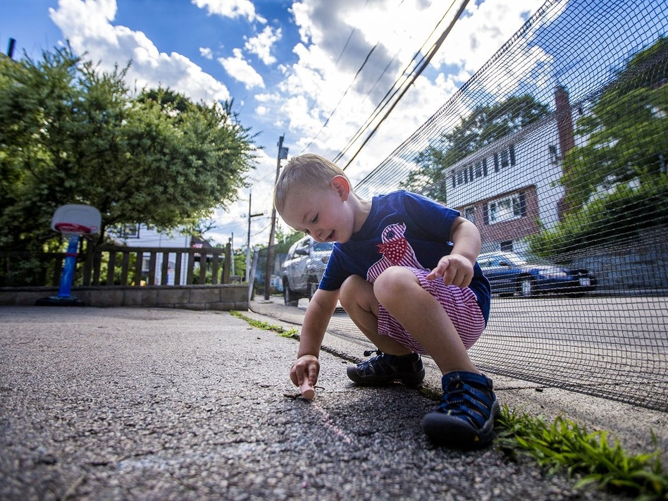 Two-year-old Robbie Klein has hemophilia, a medical condition that interferes with his blood's ability to clot normally. Without insurance, the daily medications he needs to stay healthy could cost hundreds of thousands of dollars or more each year. (Jesse Costa/WBUR)