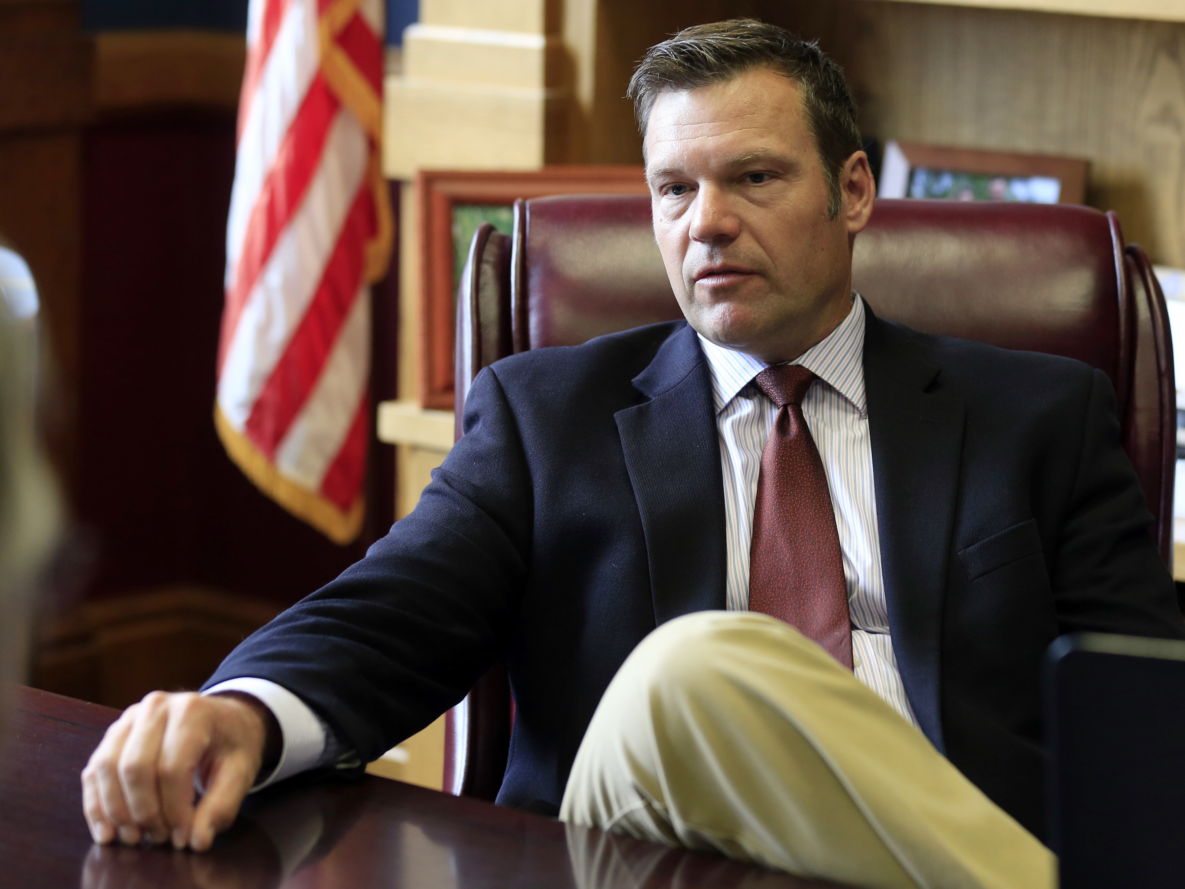 Kansas Secretary of State Kris Kobach talks with a reporter in his office in Topeka, Kan., in May of this year, after he was appointed by President Trump to co-chair the Presidential Commission on Election Integrity.