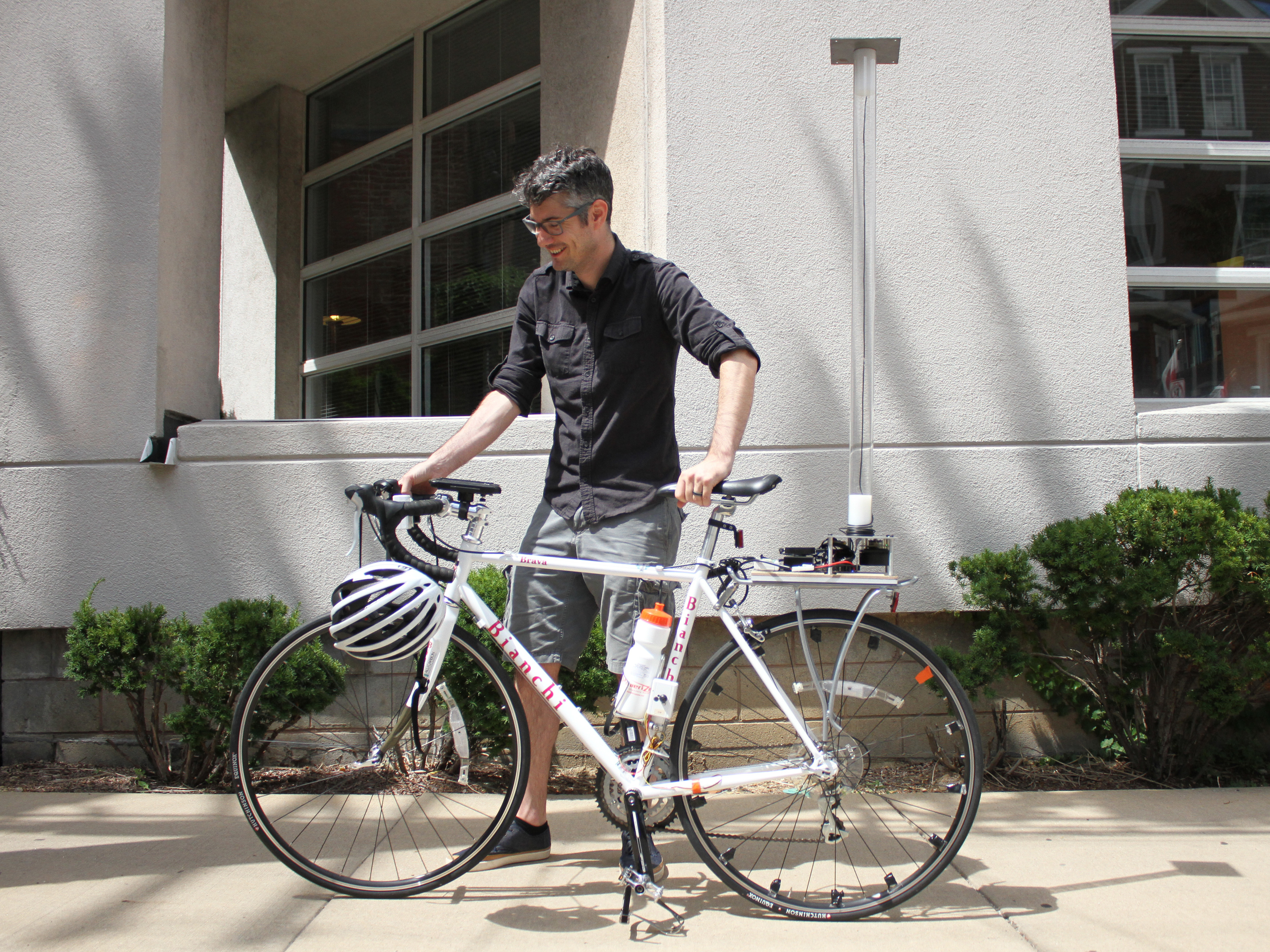 Anthony Rowe, an associate professor at Carnegie Mellon University in Pittsburgh, wants bikes to feed information to nearby cars to avoid collisions. His bike is fitted with an array of precise instruments and a battery hidden in the water bottle. (WESA)