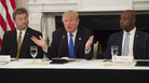 President Trump speaks alongside Republican Sens. Dean Heller of Nevada (left) and Tim Scott of South Carolina during a meeting with lawmakers to discuss the health care bill on Wednesday.