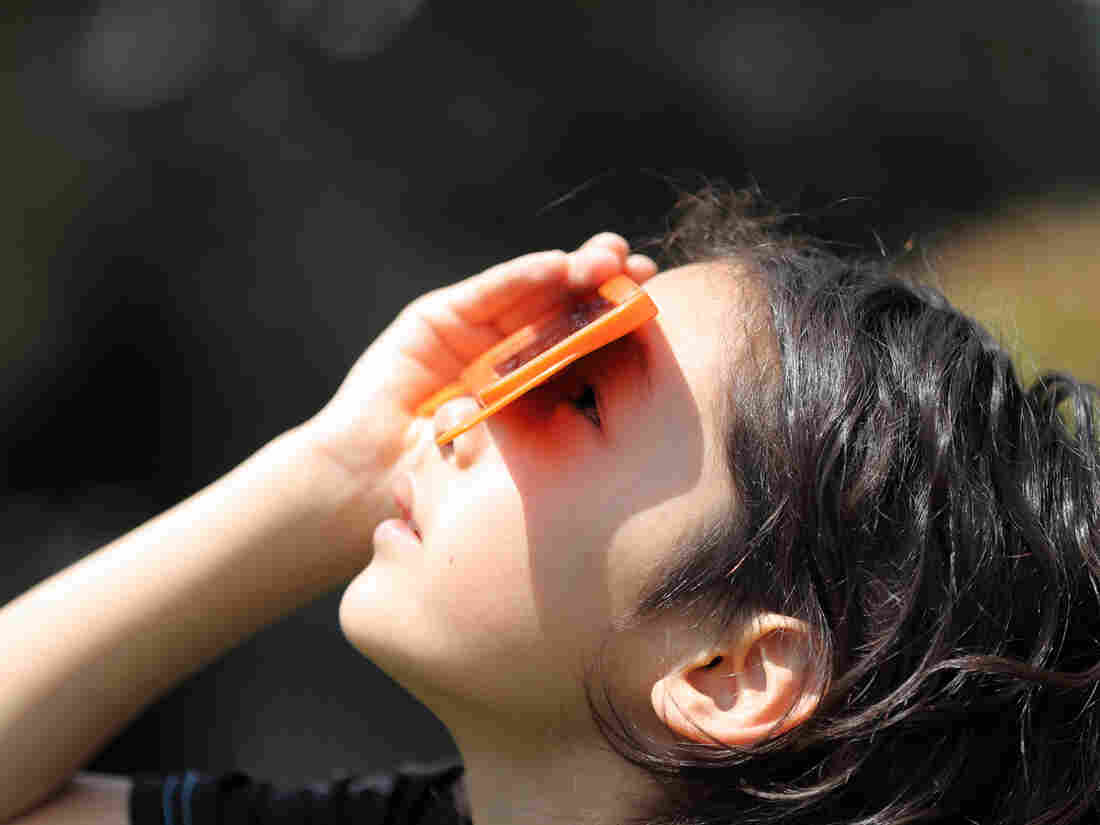 A child watches a solar eclipse on May 20, 2012, in Japan.