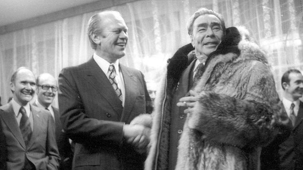 President Gerald Ford shakes hands with Soviet leader Leonid Brezhnev on Nov. 24, 1974, in a meeting in the Soviet city of Vladivostok. Several weeks later, Ford signed a law that would place restrictions on Soviet trade with the U.S. for nearly four decades.