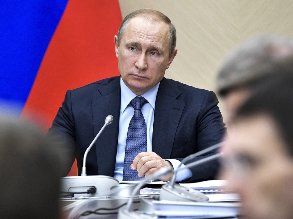 Russian President Vladimir Putin leads a Cabinet meeting at the Novo-Ogaryovo residence outside Moscow on Wednesday. (Alexei Nikolsky/AP)