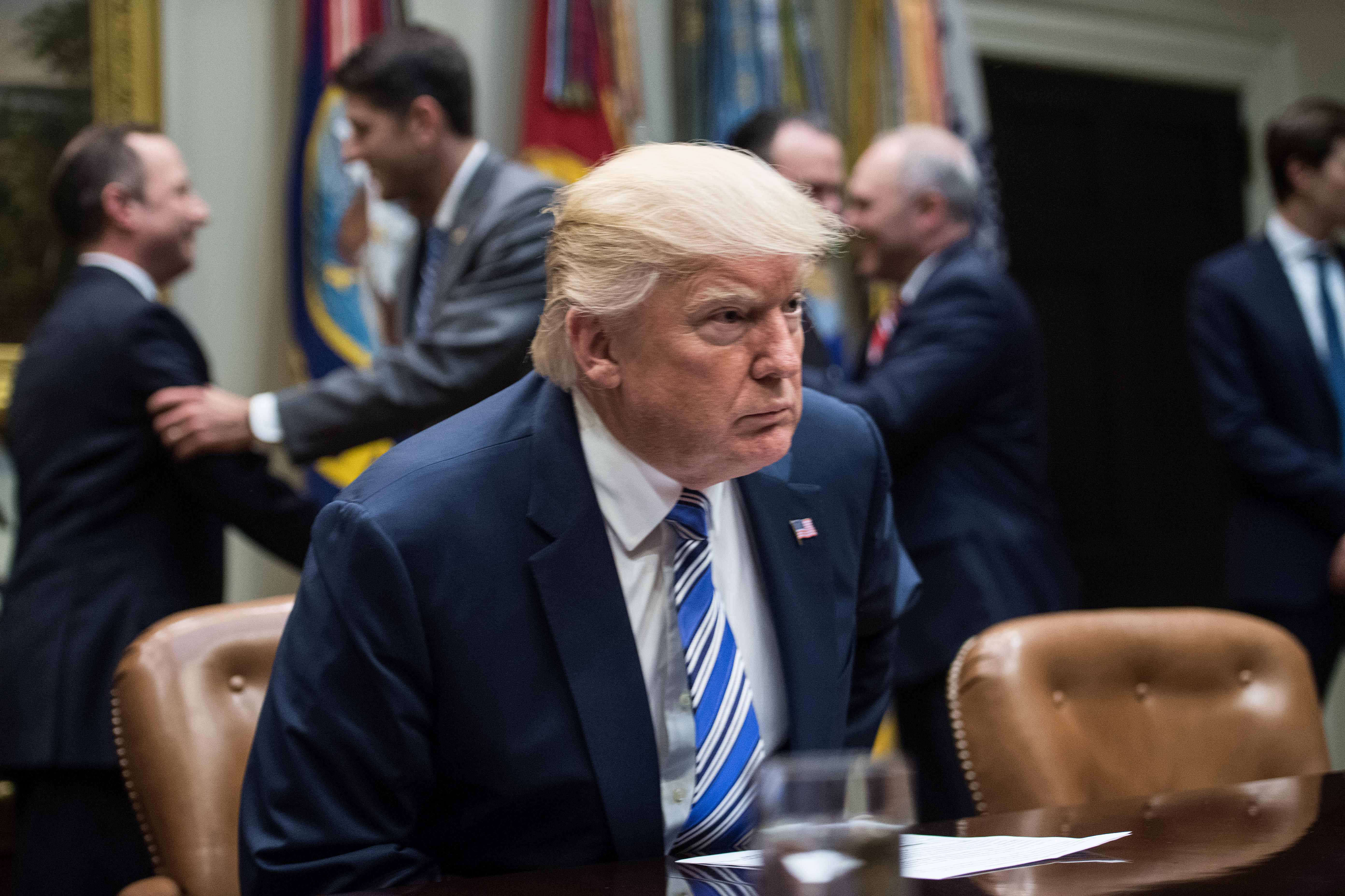 President Donald Trump takes his seat as he meets with Republican congressional leaders at the White House in June. (AFP/Getty Images)